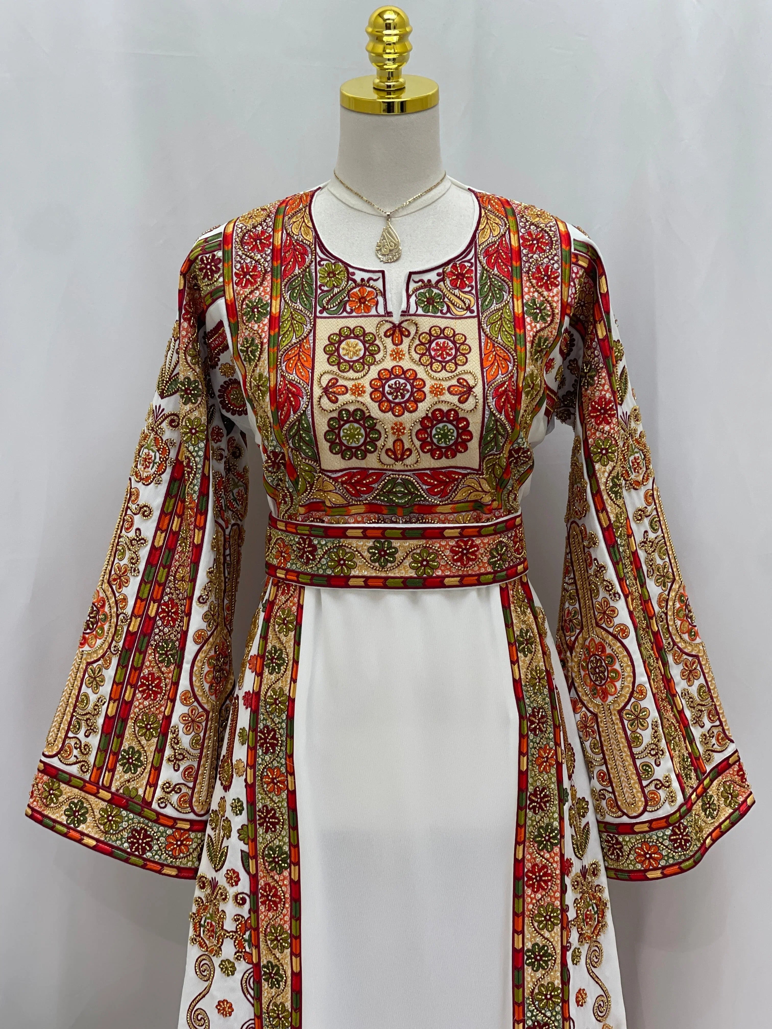 Golden Blossom Beaded Embroidered Thobe by Palestinian Elegance white dress with floral beaded embroidery and wide sleeves