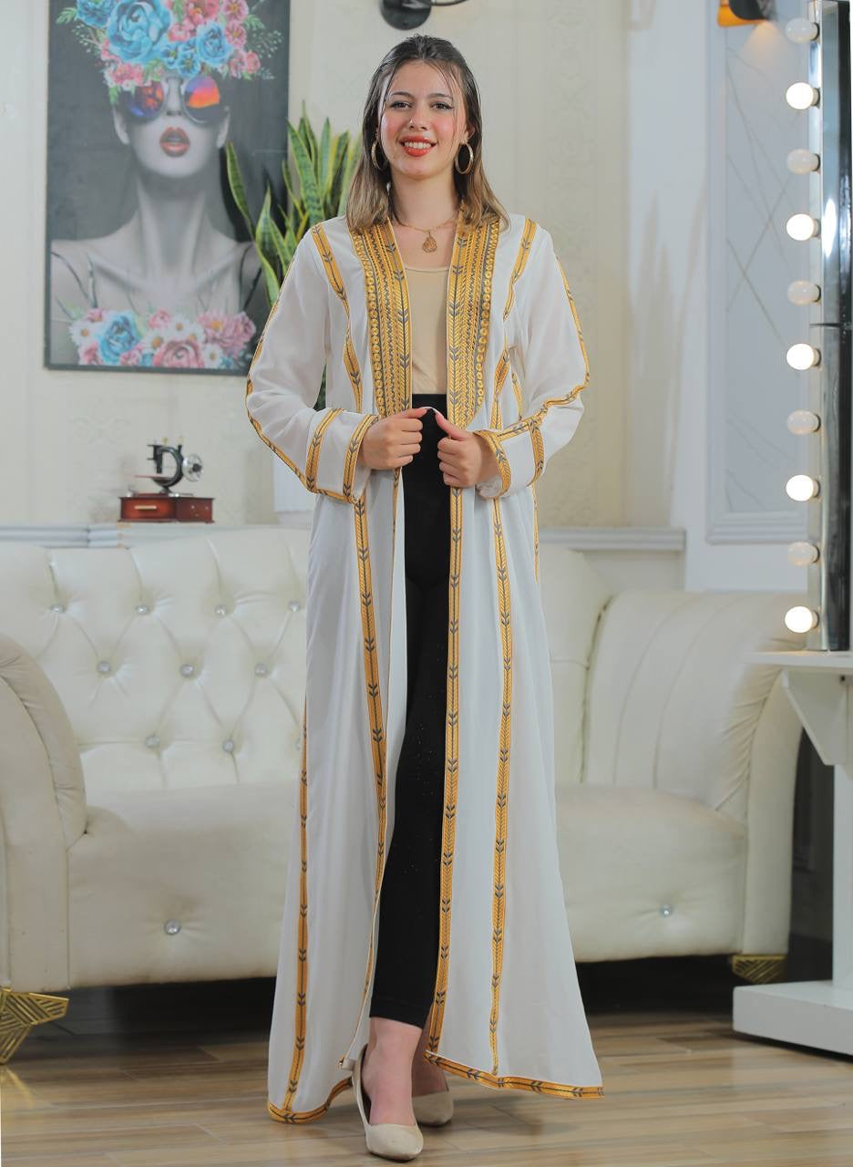 Golden Touch Open Abaya cardigan by Palestinian Elegance white long open front embroidered gold trim model wearing black pants