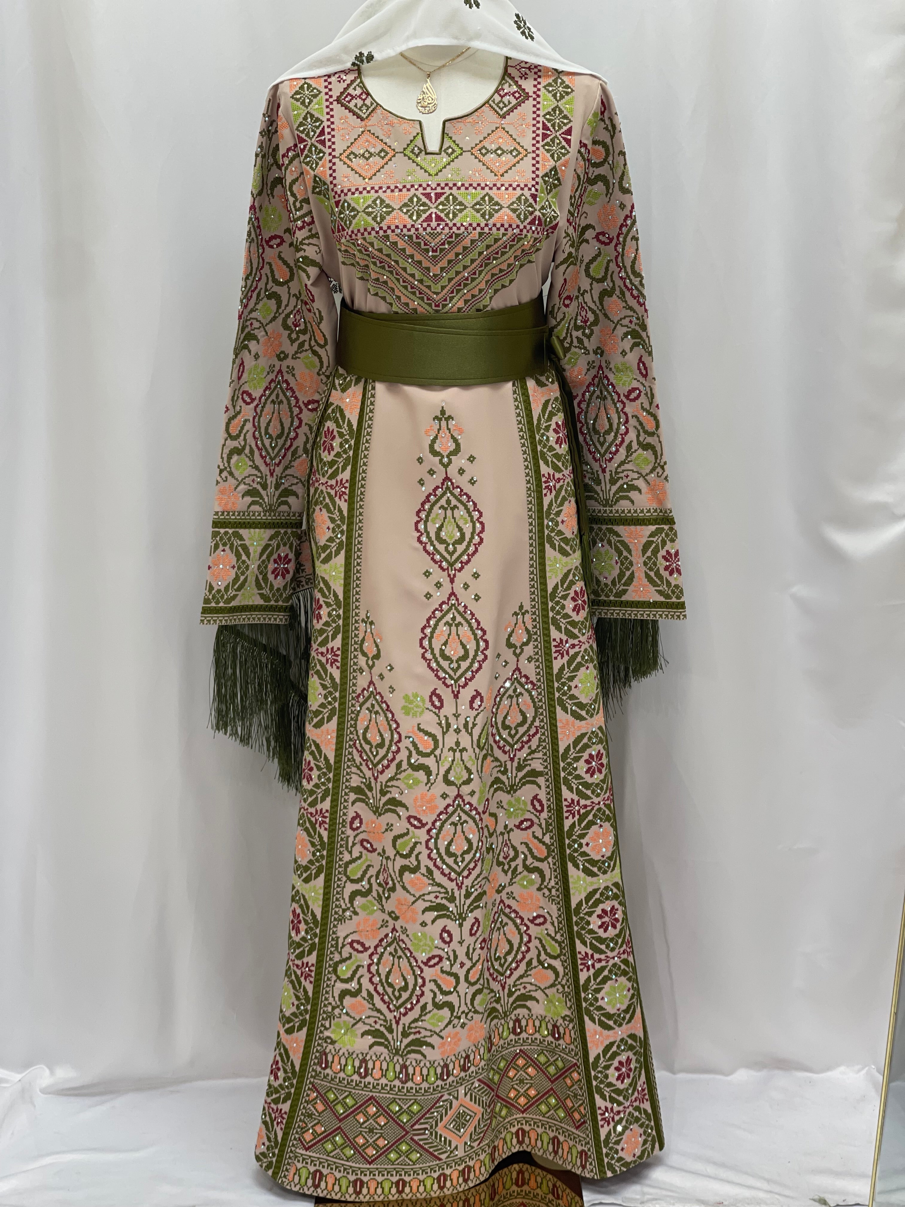 Green Ruby Embroidered Thobe featuring intricate floral designs and a comfortable belt