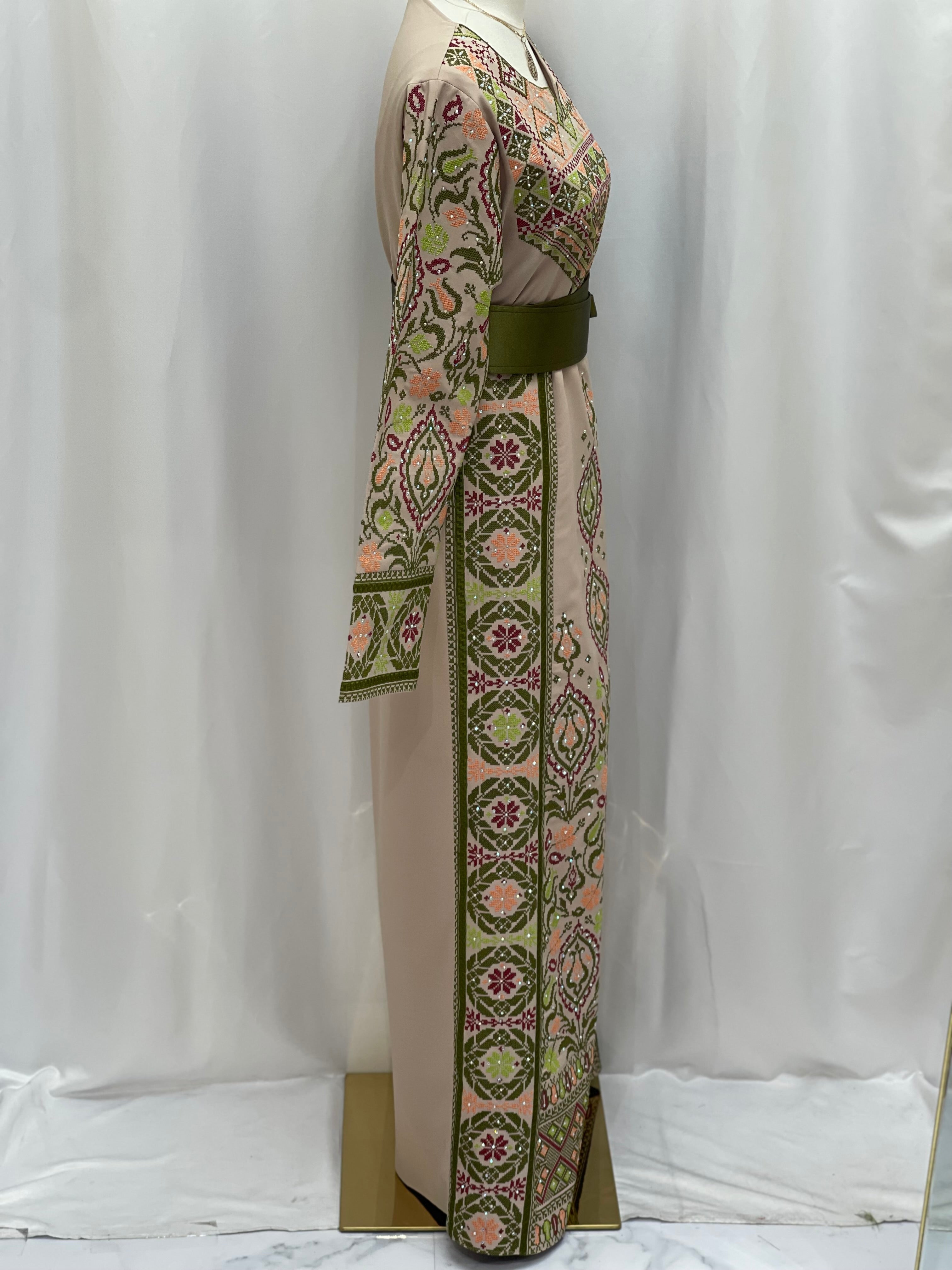 Green Ruby Embroidered Thobe featuring intricate floral designs and elegant belt detail