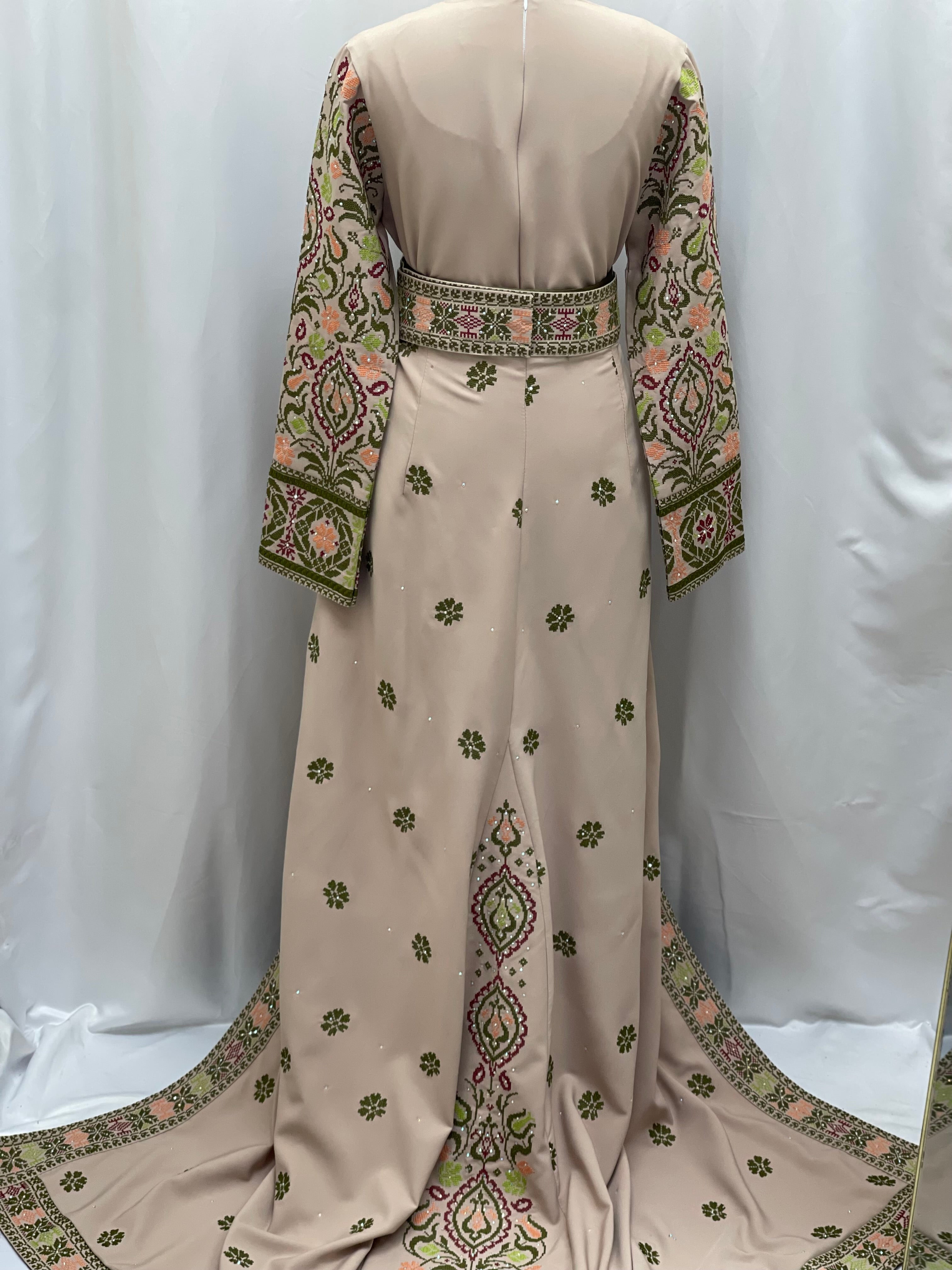 Back view of Green Ruby Embroidered Thobe featuring intricate floral designs and elegant embroidery.