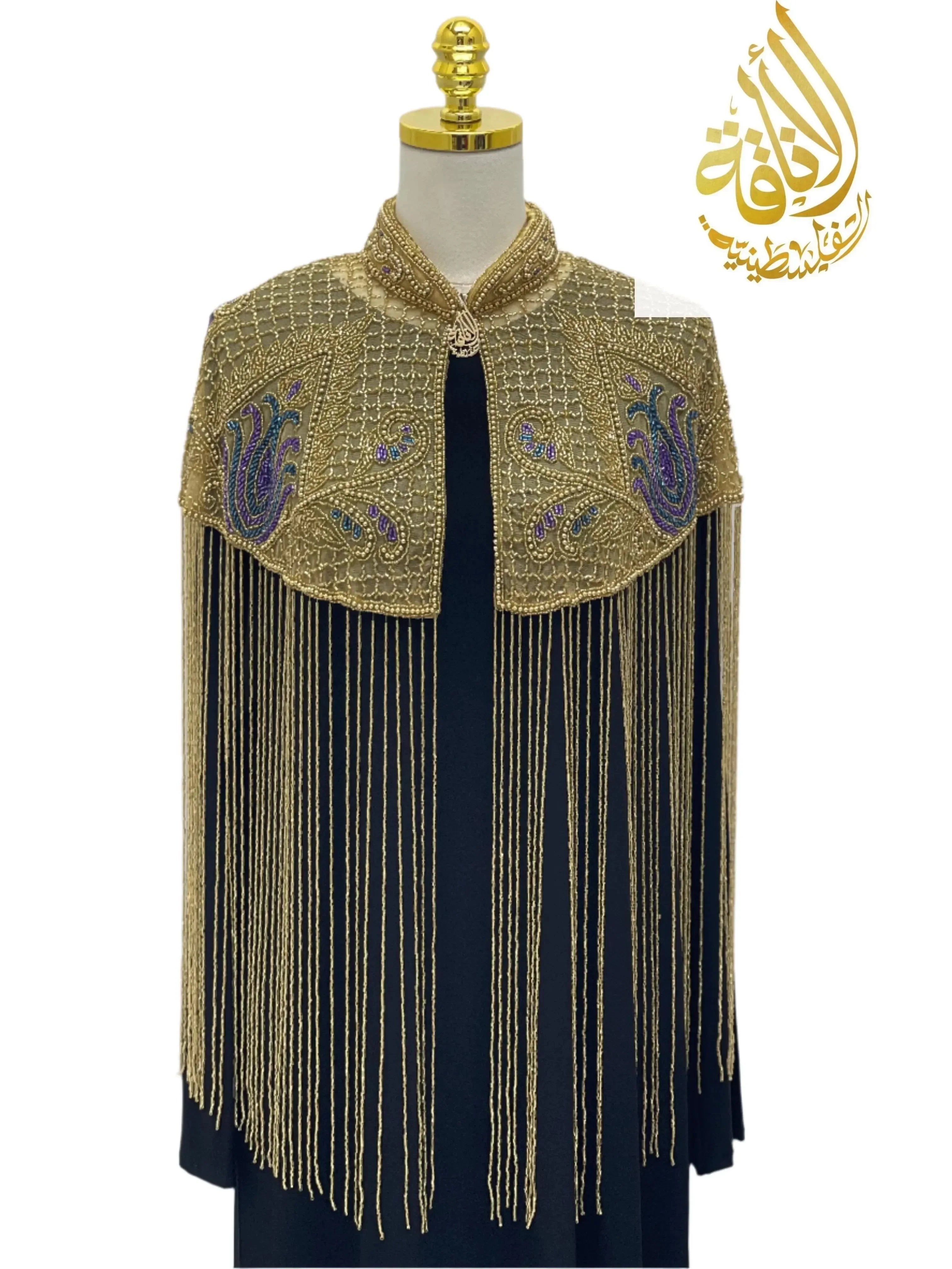 Palestinian Elegance handmade beaded cape with intricate gold beads and fringe detailing over black dress