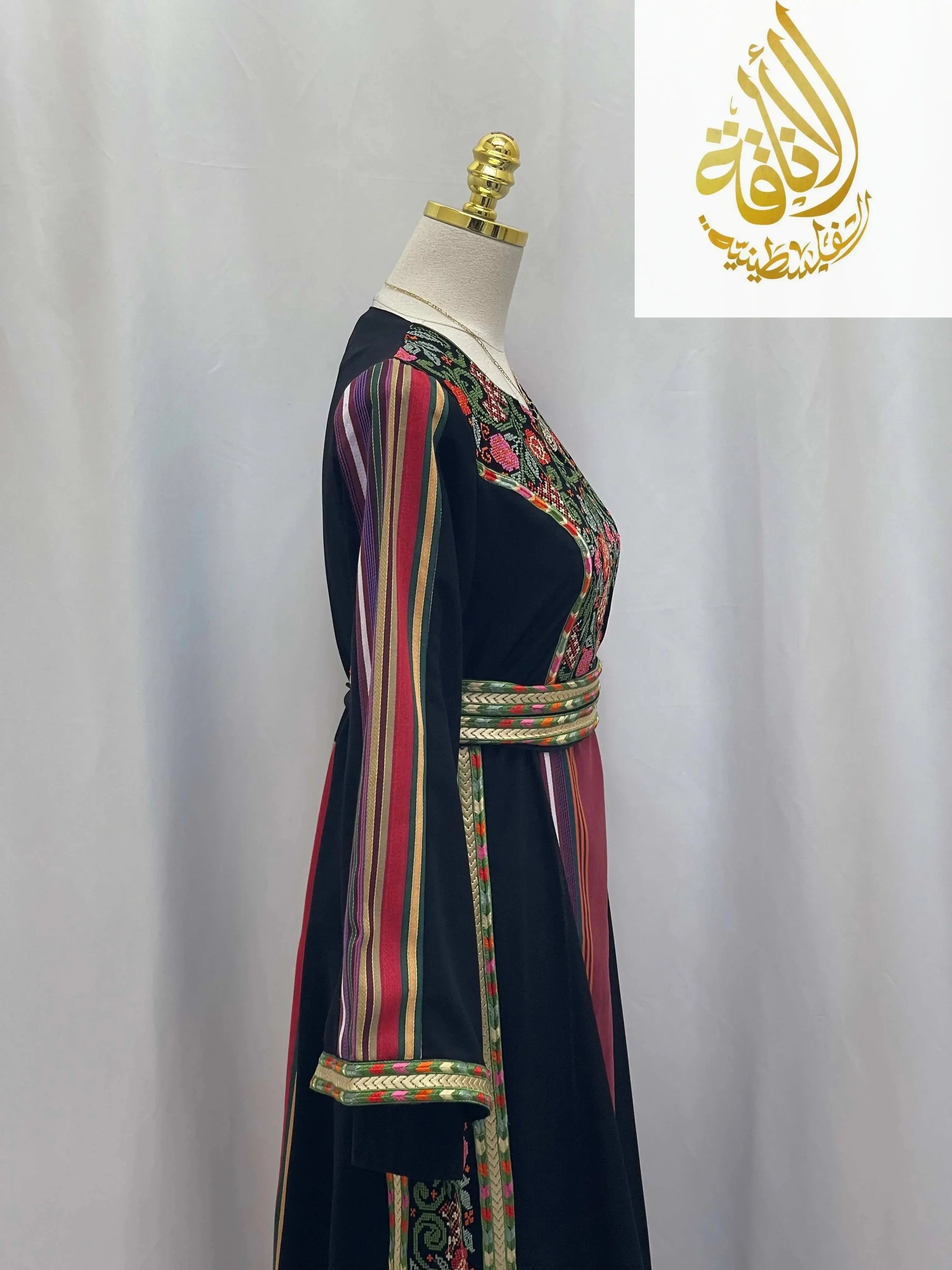 Palestinian Elegance Haya Embroidered Majdalawe Dress thoub with colorful striped sleeves and intricate embroidery