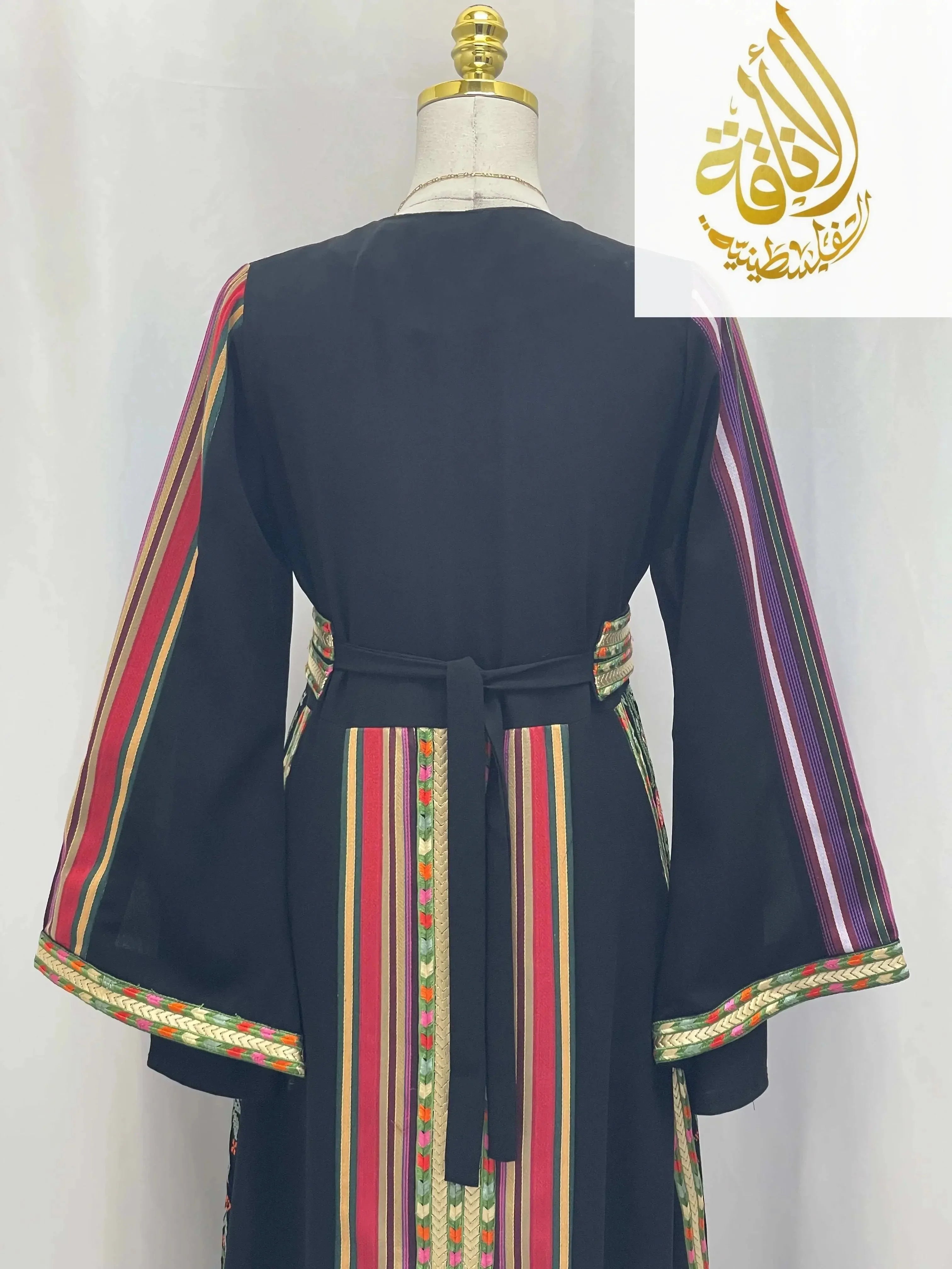 Back view of Haya Embroidered Majdalawe Dress thoub by Palestinian Elegance with multicolor striped embroidery and belt