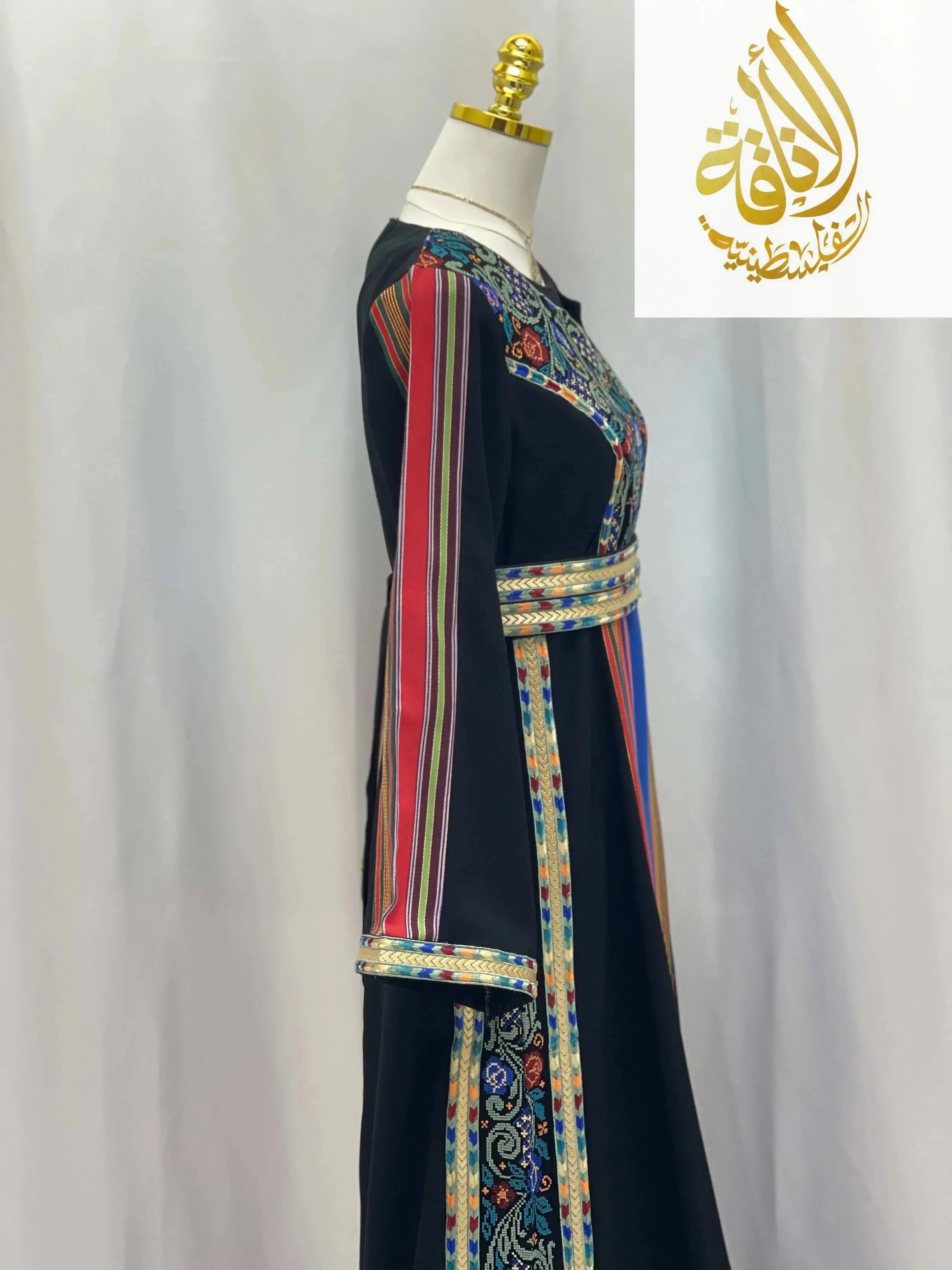 Palestinian Elegance Haya Embroidered Majdalawe Dress thoub with colorful embroidery and striped patterns