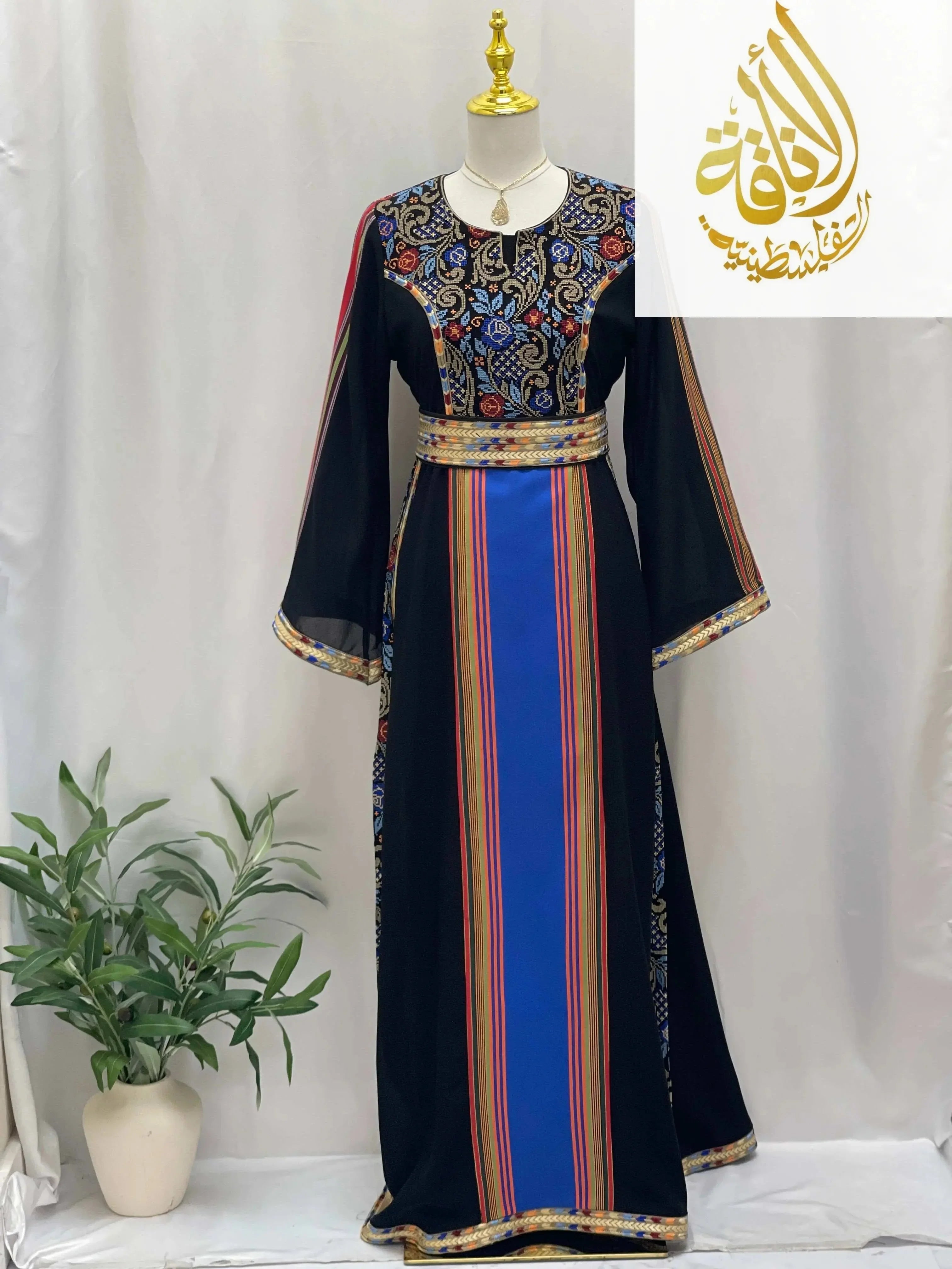 Haya Embroidered Majdalawe Dress by Palestinian Elegance with colorful embroidery and striped design on black thoub