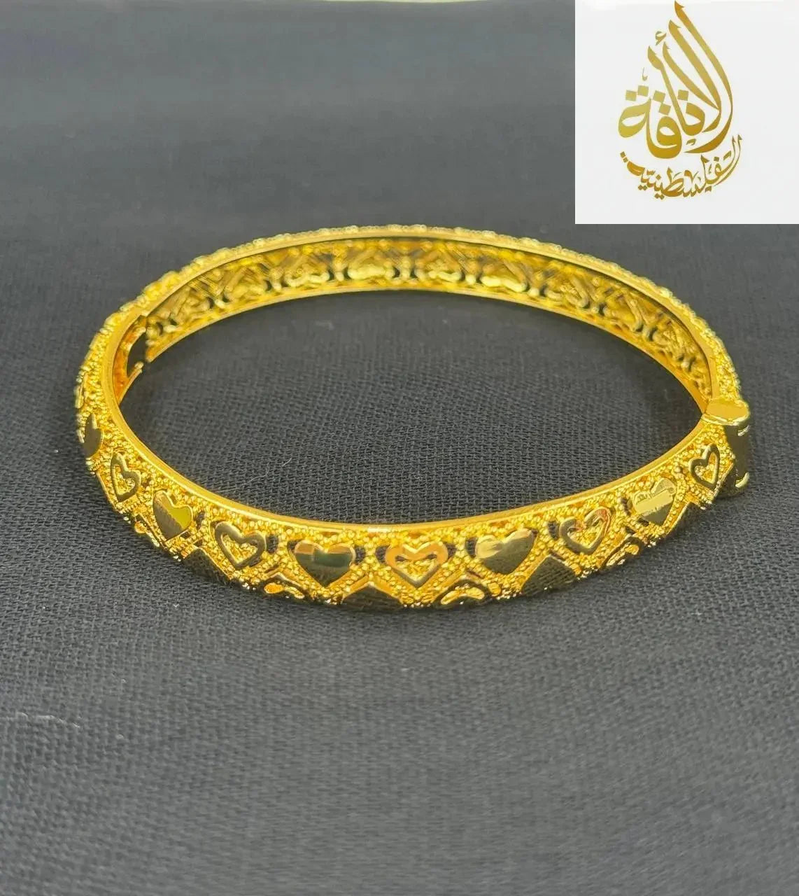 Palestinian Elegance heart design gold bangle bracelet in imitated gold with intricate cutout hearts