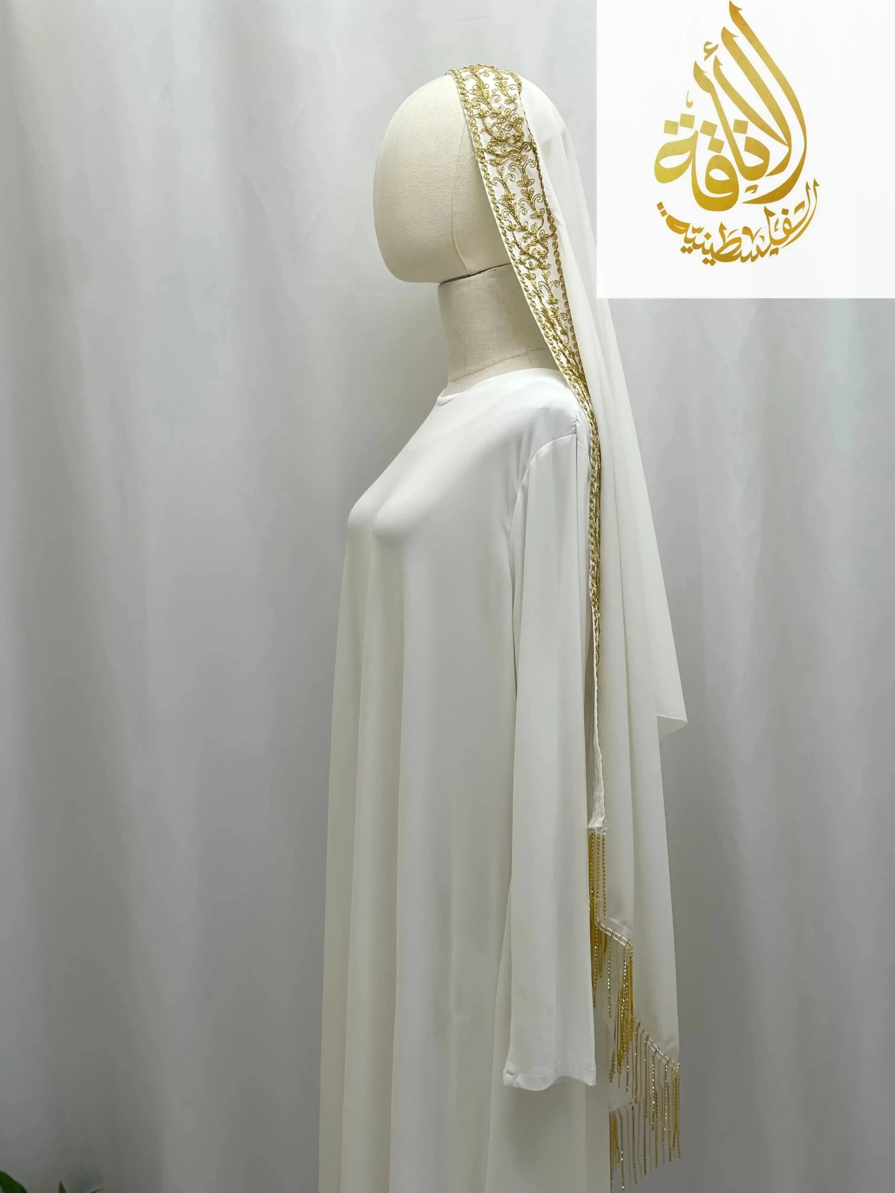 Palestinian Traditional Modest Fashion Kasab Khirka white dress with gold embroidery and headscarf by Palestinian Elegance