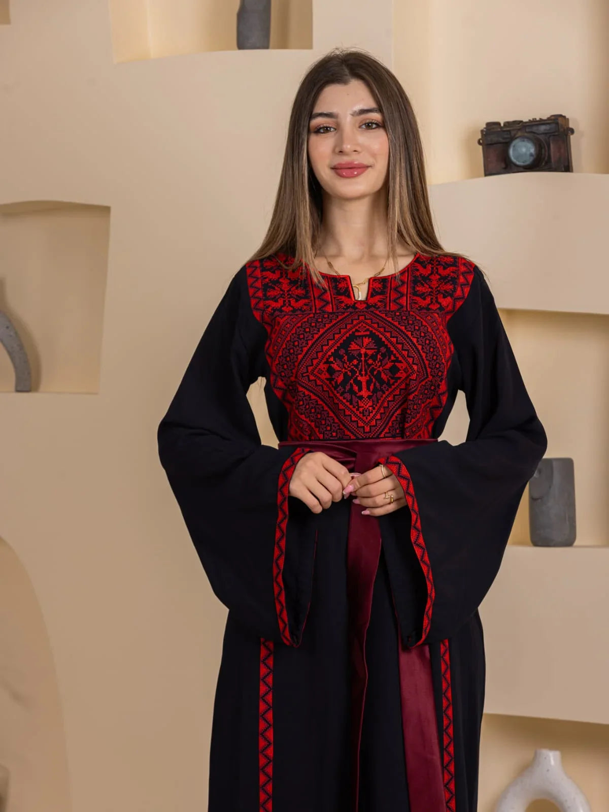 Huda Simply Embroidered Thoub black Palestinian thobe with red chest embroidery and bell sleeves by Palestinian Elegance