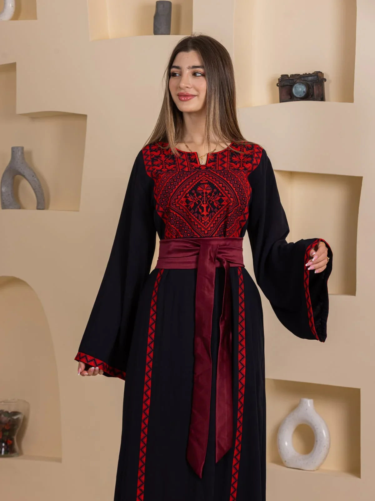 Huda Simply Embroidered Thoub Palestinian Elegance black thobe with red embroidery and maroon sash belt