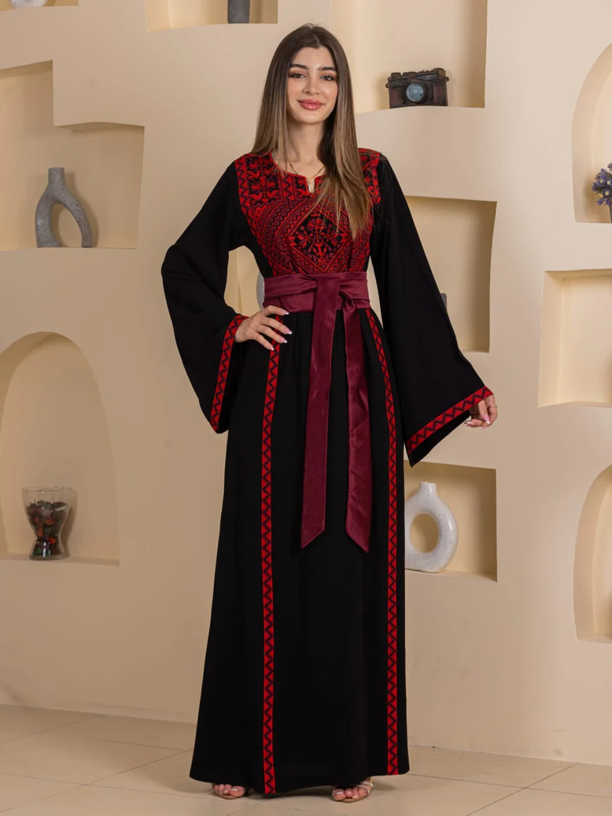 Huda Simply Embroidered Thoub by Palestinian Elegance black maxi thobe with red Palestinian embroidery and burgundy waist sash