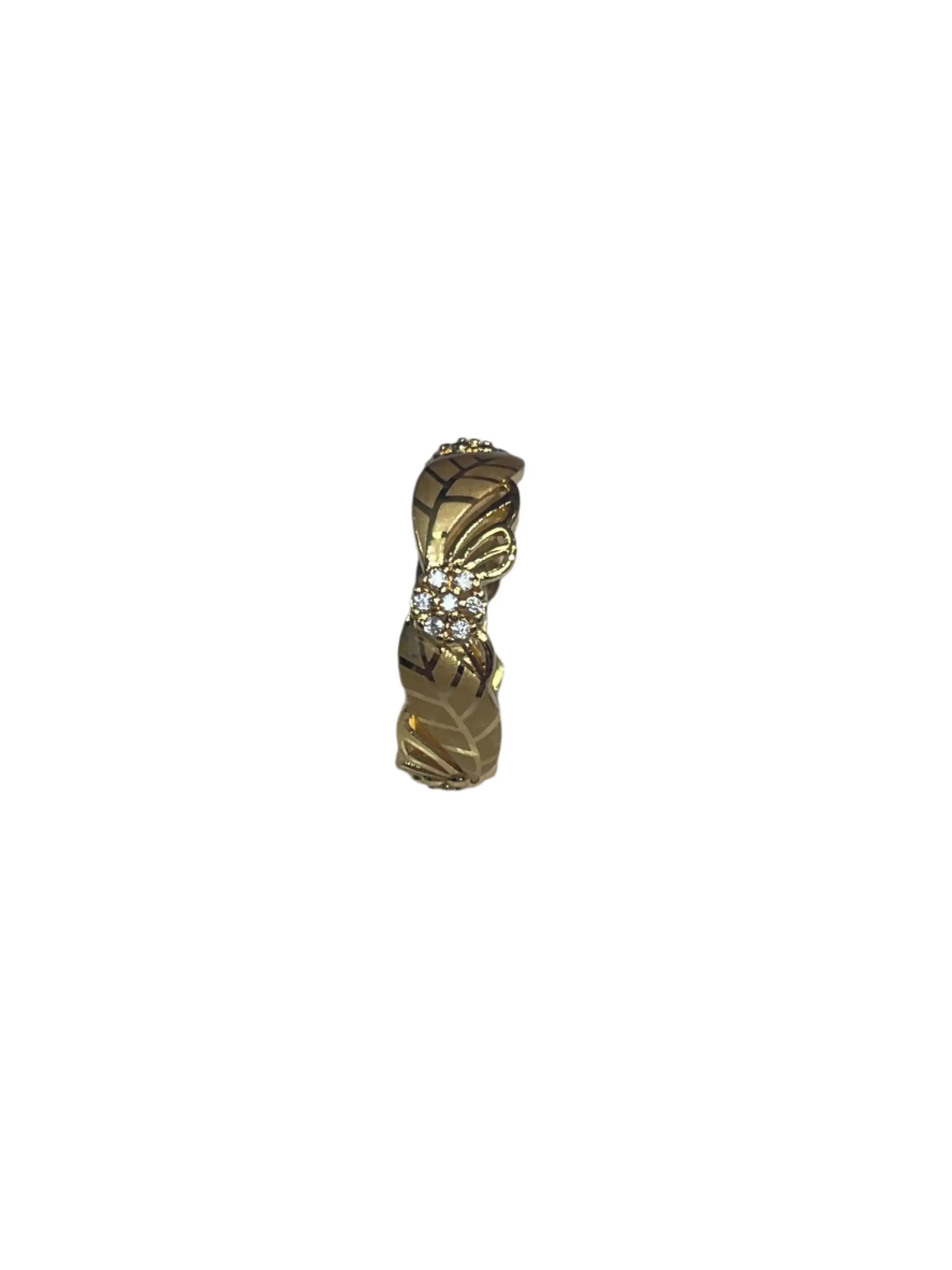 Imitated gold ring with intricate detailing and small stones from heritage-inspired jewelry collection