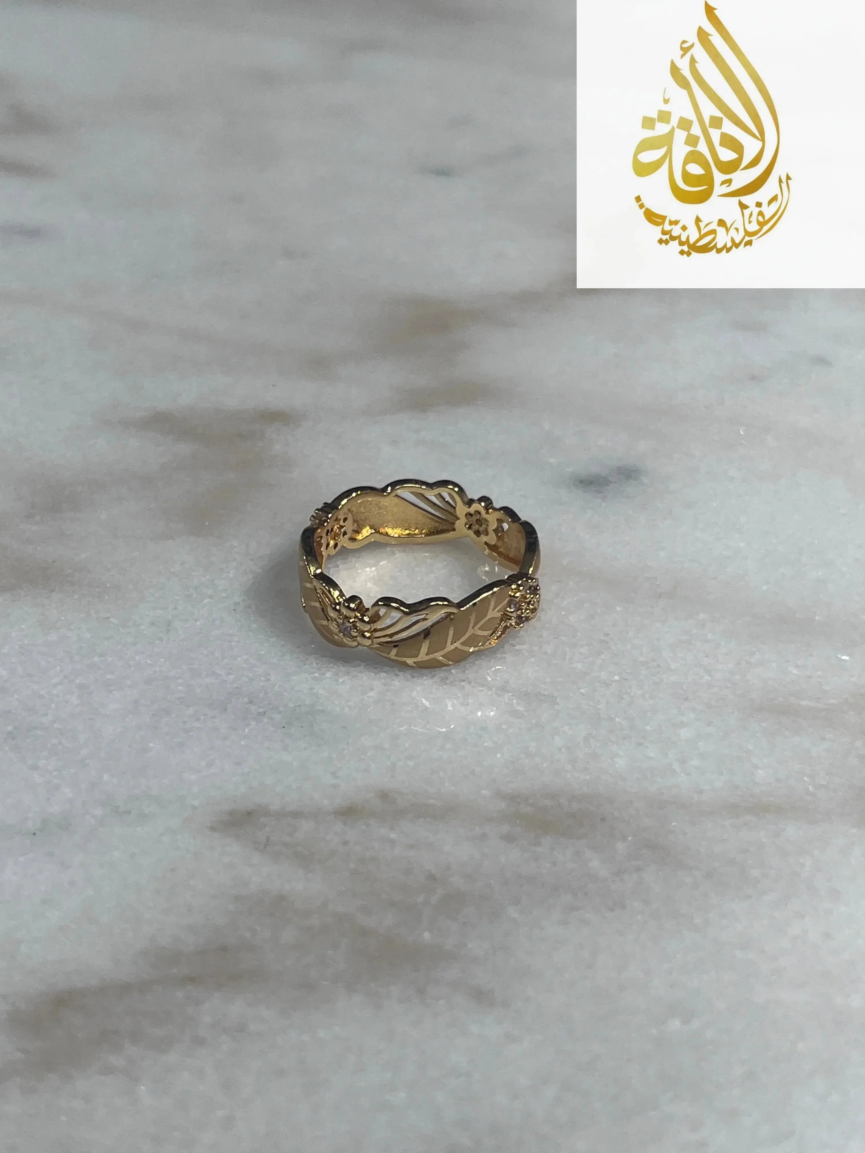 Imitated gold ring from Palestinian Elegance featuring heritage-inspired jewelry design with intricate patterns