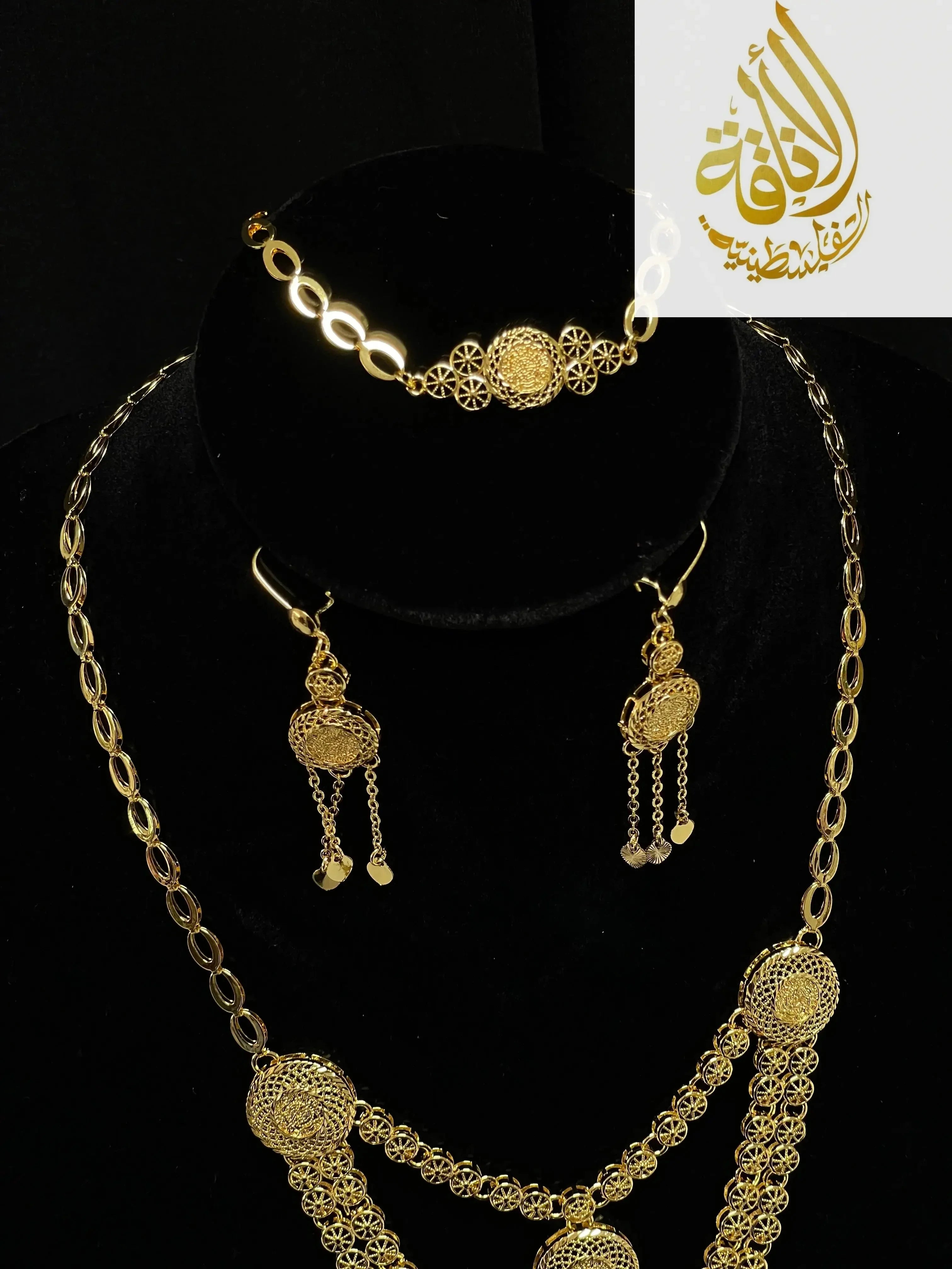 Palestinian Elegance gold layered necklace set with intricate filigree pendant and matching earrings