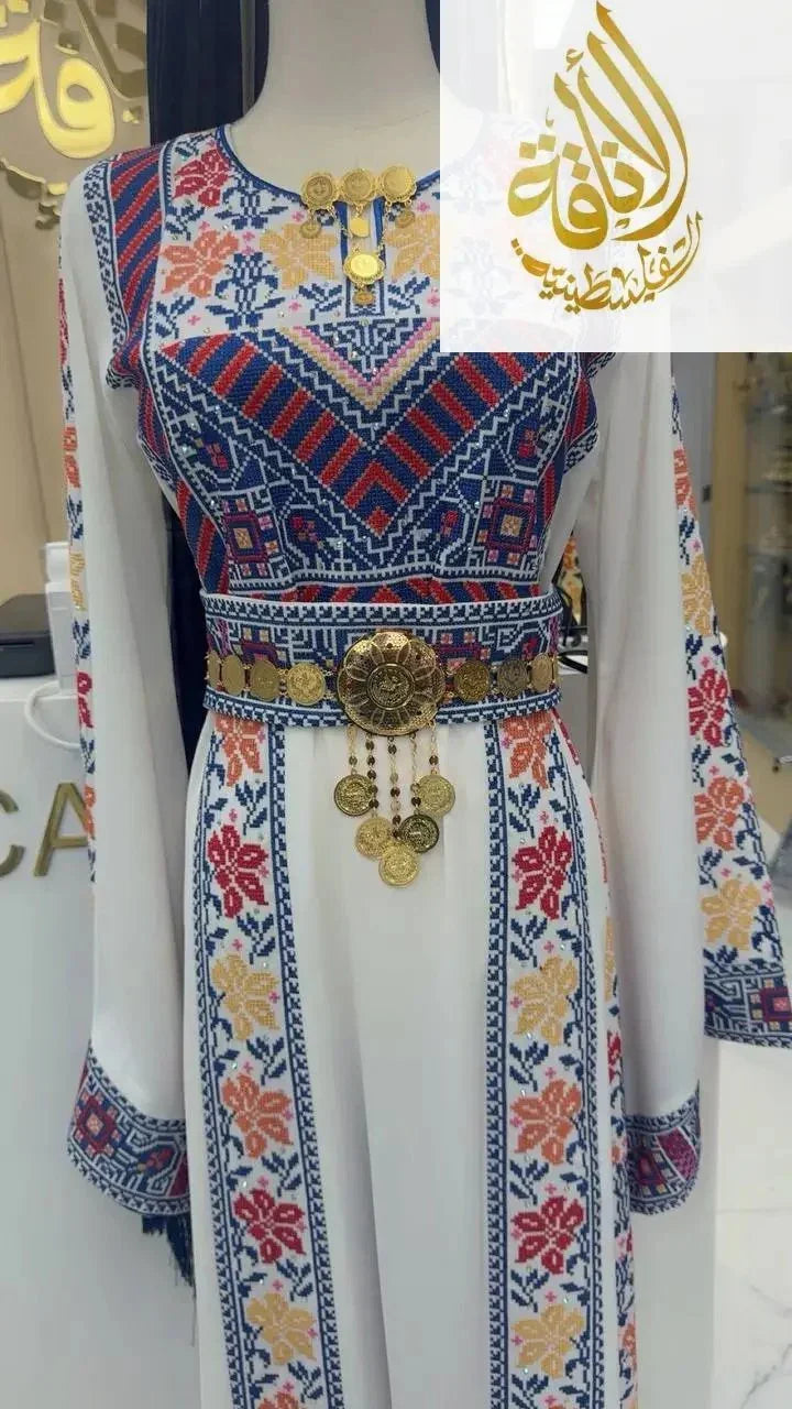 Palestinian dress featuring an imitated gold lera waist belt with intricate detailing and hanging ornaments