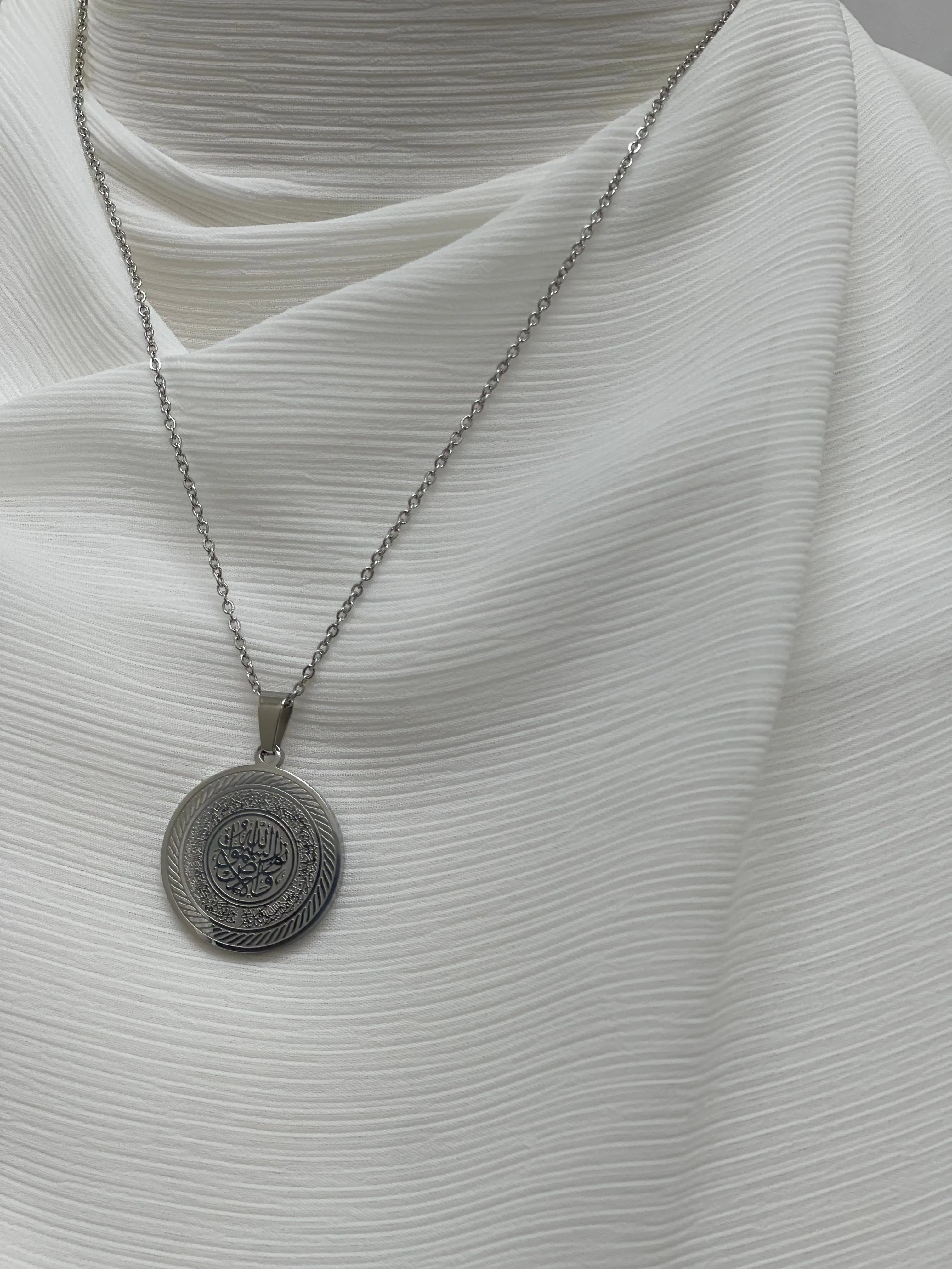 Elegant silver circle necklace from Palestinian Elegance featuring an imitated gold pendant with intricate design