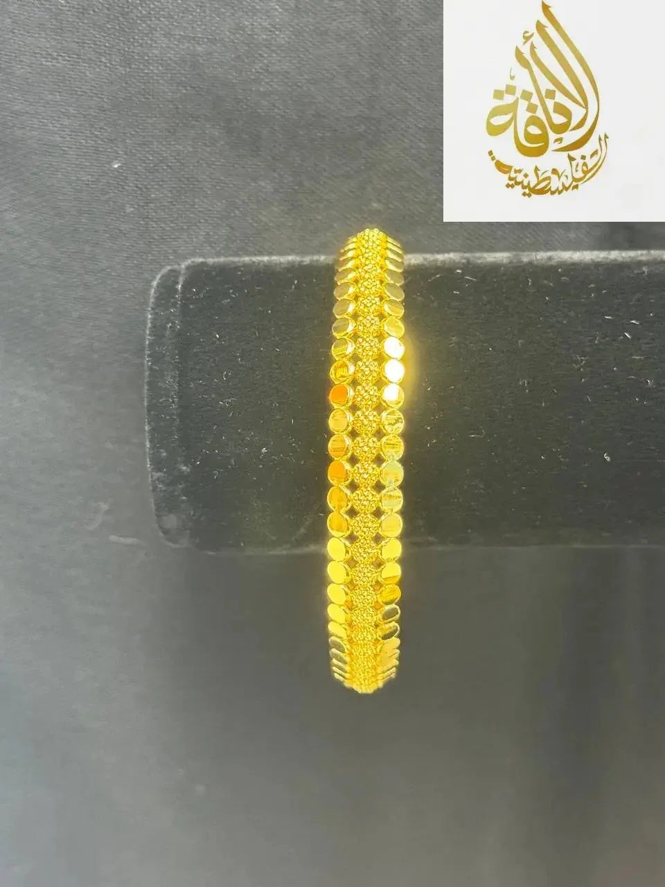 Palestinian Elegance imitation gold bangle bracelet with detailed circular pattern design