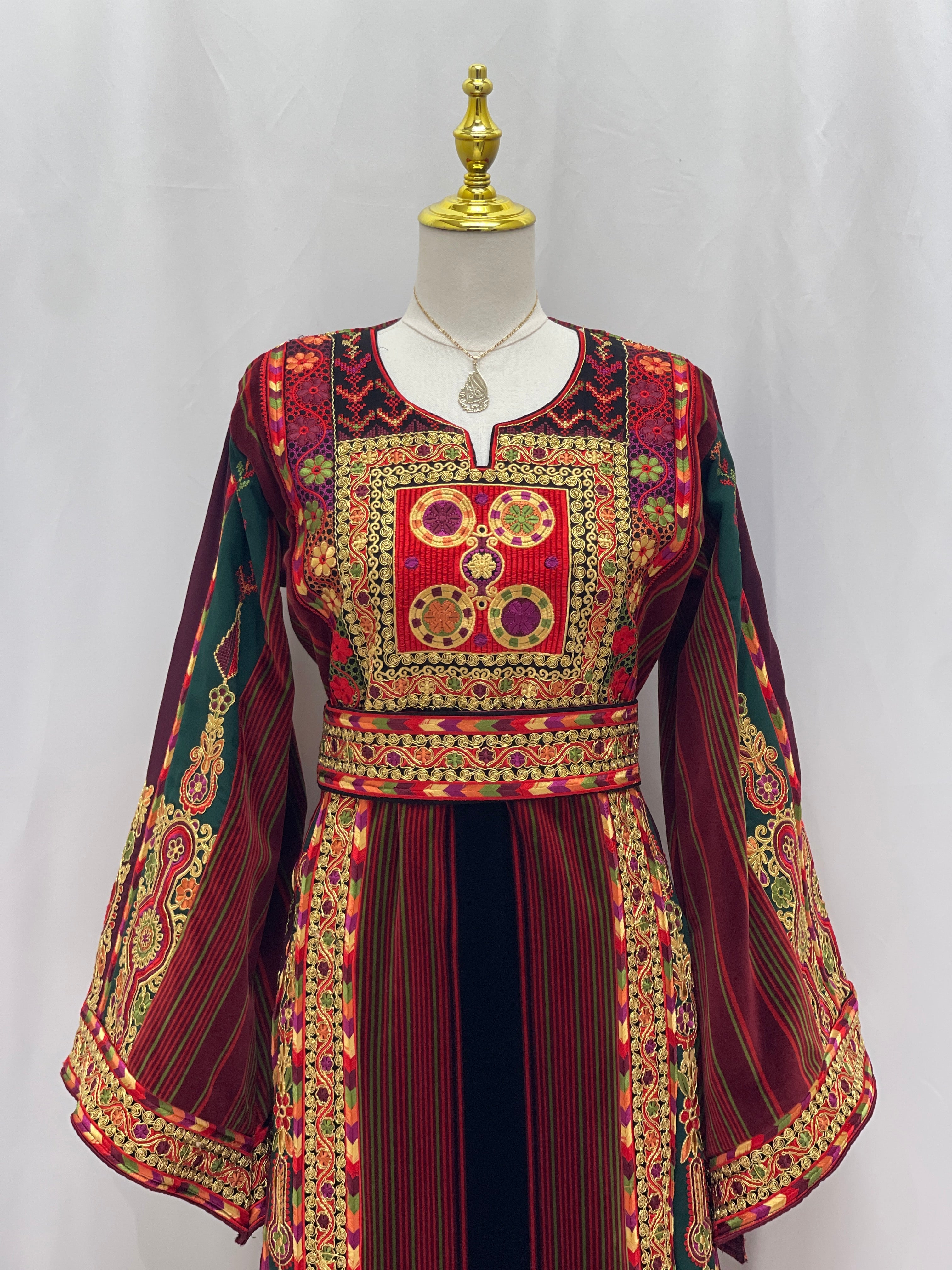 Palestinian Velvet Malaka Embroidered Thobe by Palestinian Elegance with intricate red and gold embroidery and striped patterns