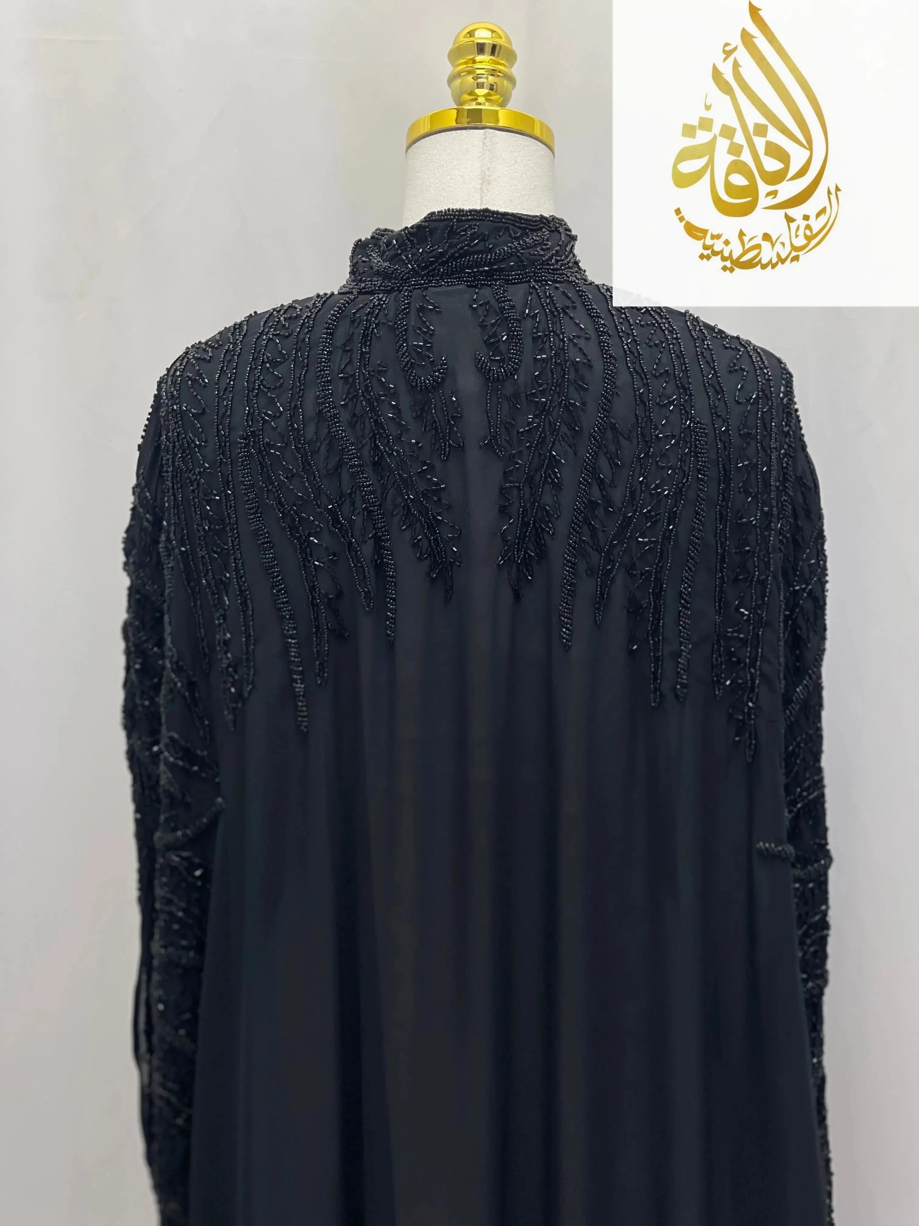 Back view of black Karam Fancy Beads Cape cardigan by Palestinian Elegance with intricate beadwork