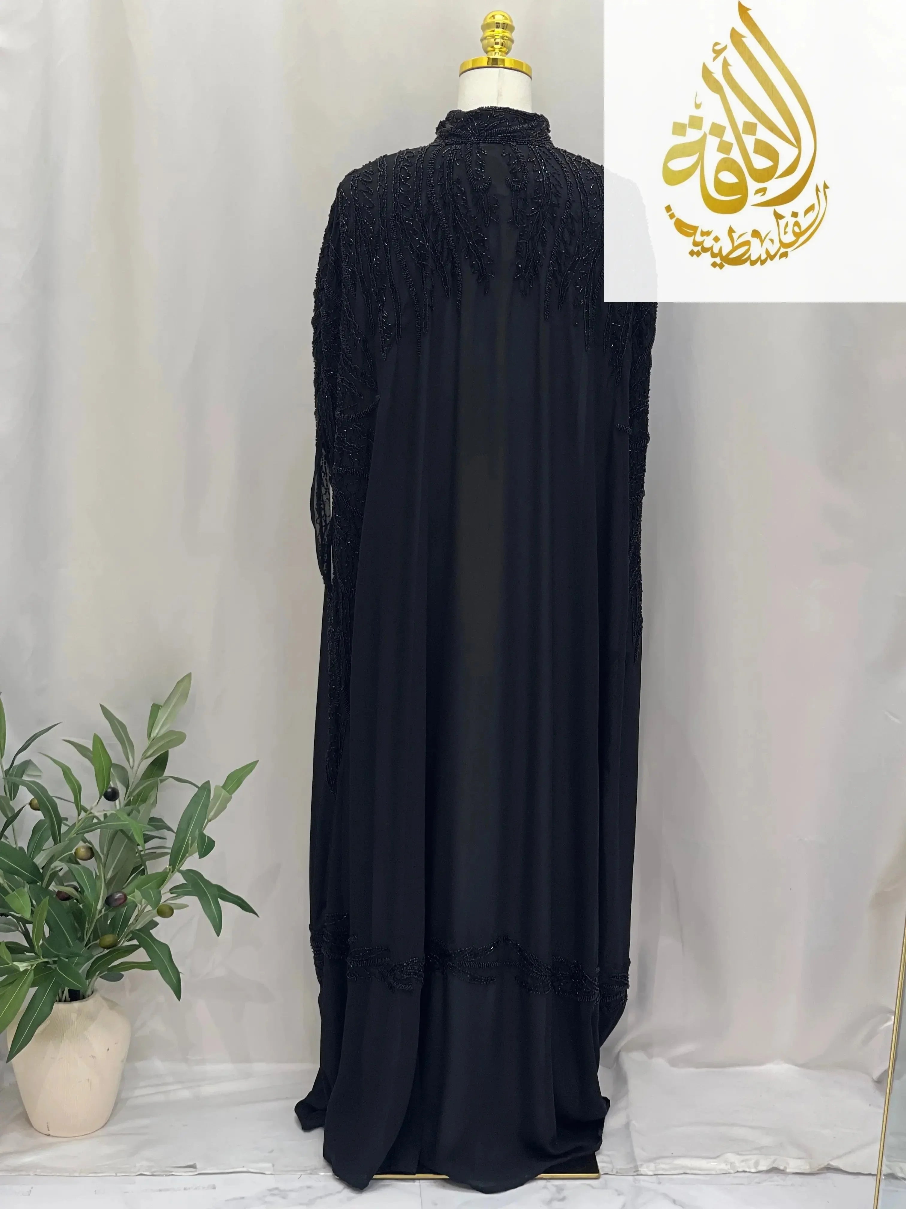 Black Karam Fancy Beads Cape cardigan by Palestinian Elegance with intricate beadwork and long flowing design