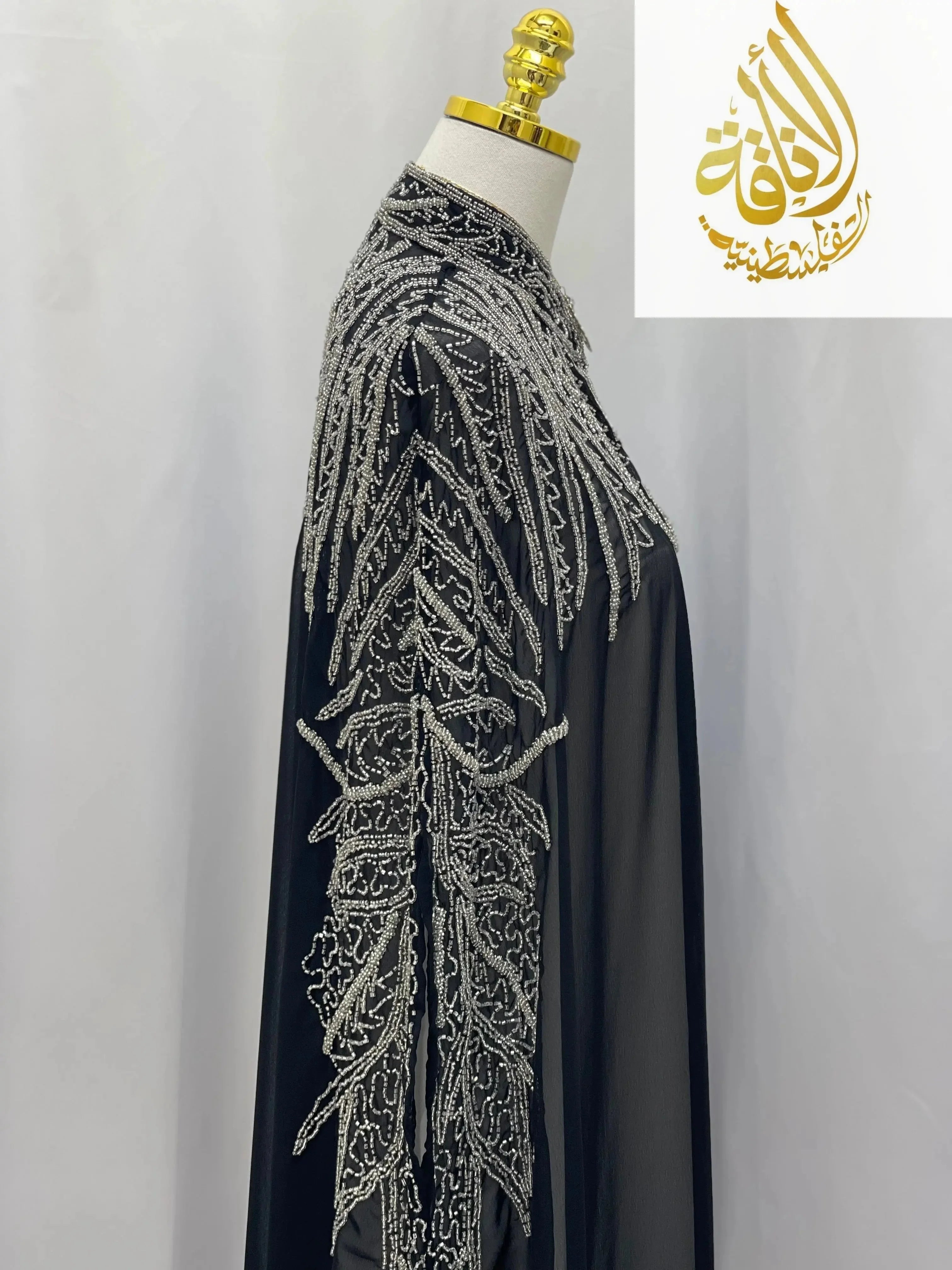 Palestinian Elegance Karam Fancy Beads Cape cardigan with intricate silver bead embroidery on black fabric