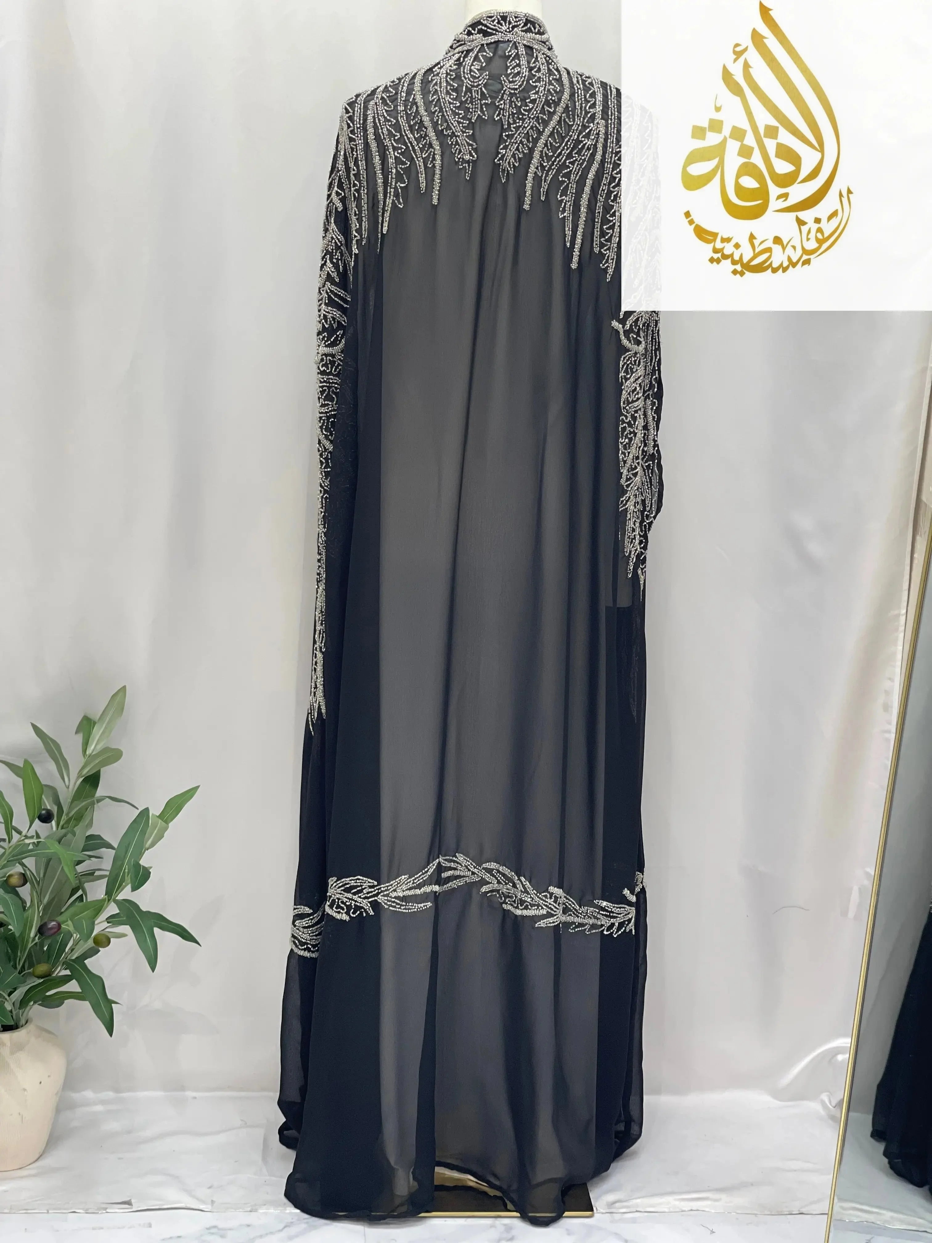 Black sheer cardigan by Palestinian Elegance featuring intricate embroidery and Karam Fancy Beads Cape design