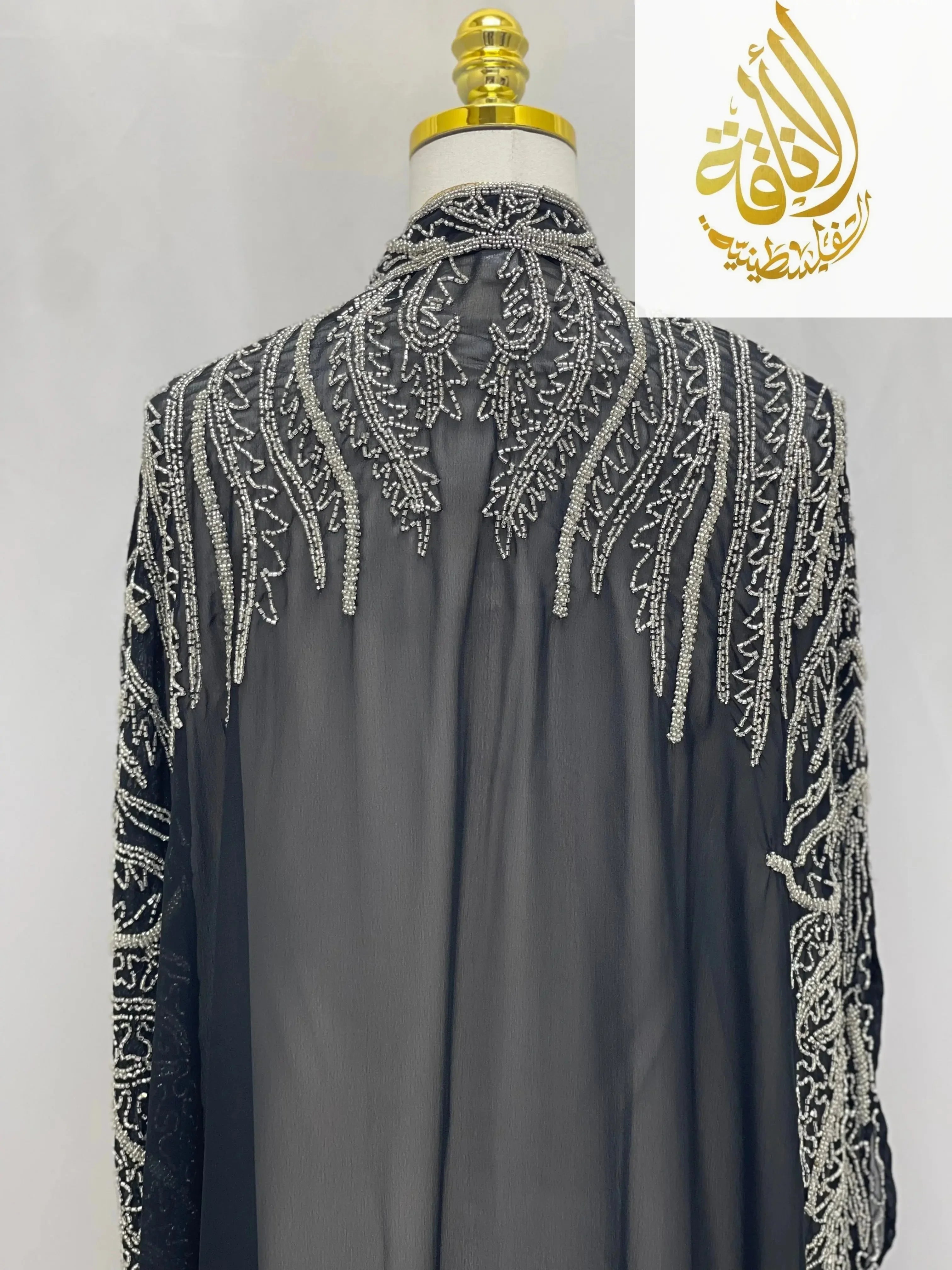 Back view of black cardigan with intricate bead embroidery by Palestinian Elegance Karam Fancy Beads Cape