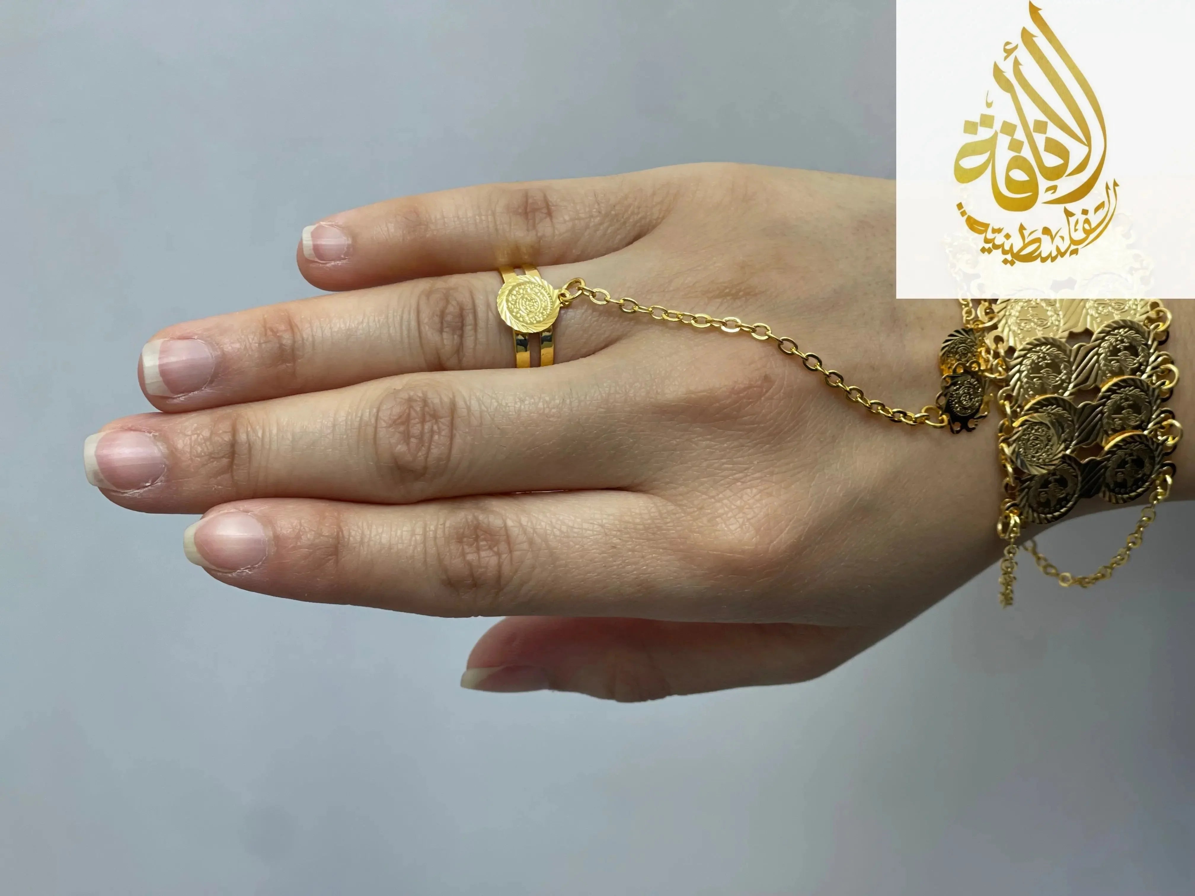 Kids Imitated Gold Bracelet With Ring Set featuring gold coin design on hand with linked chain