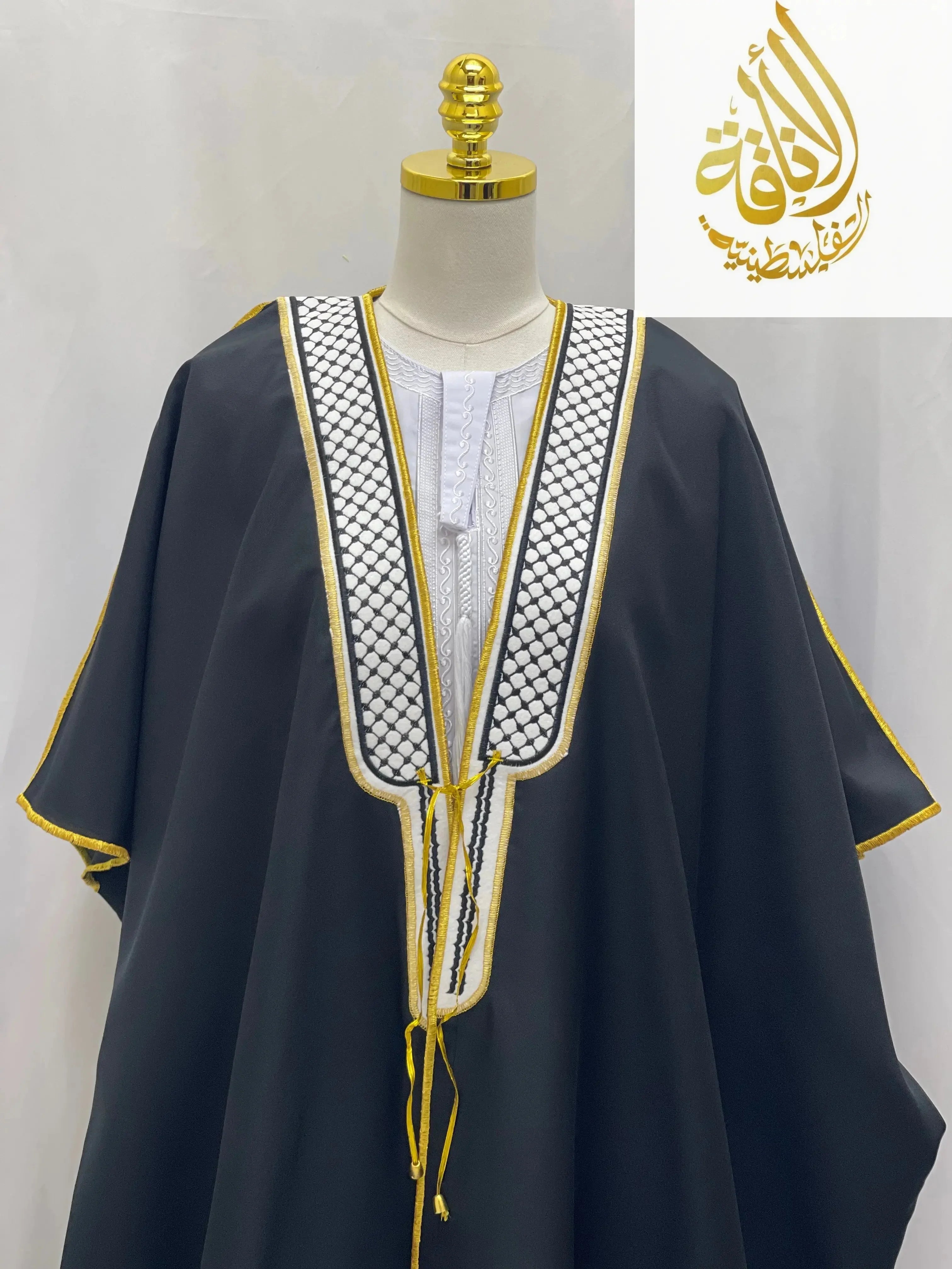 Palestinian Elegance men thobe featuring a black keffiyeh bisht for sale with traditional white and gold embroidery