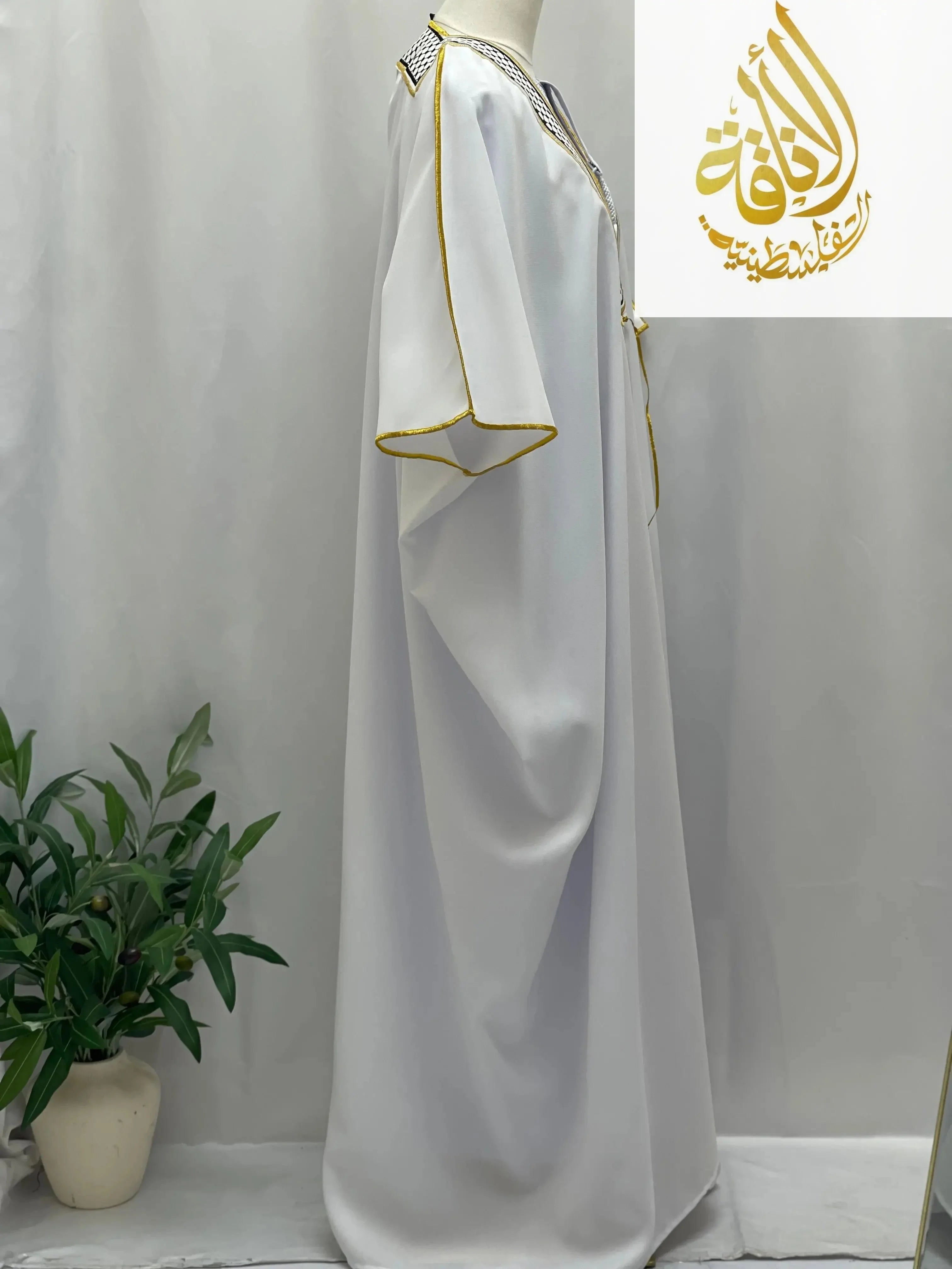 Palestinian Elegance men thobe in white with gold trim showcasing keffiyeh bisht for sale