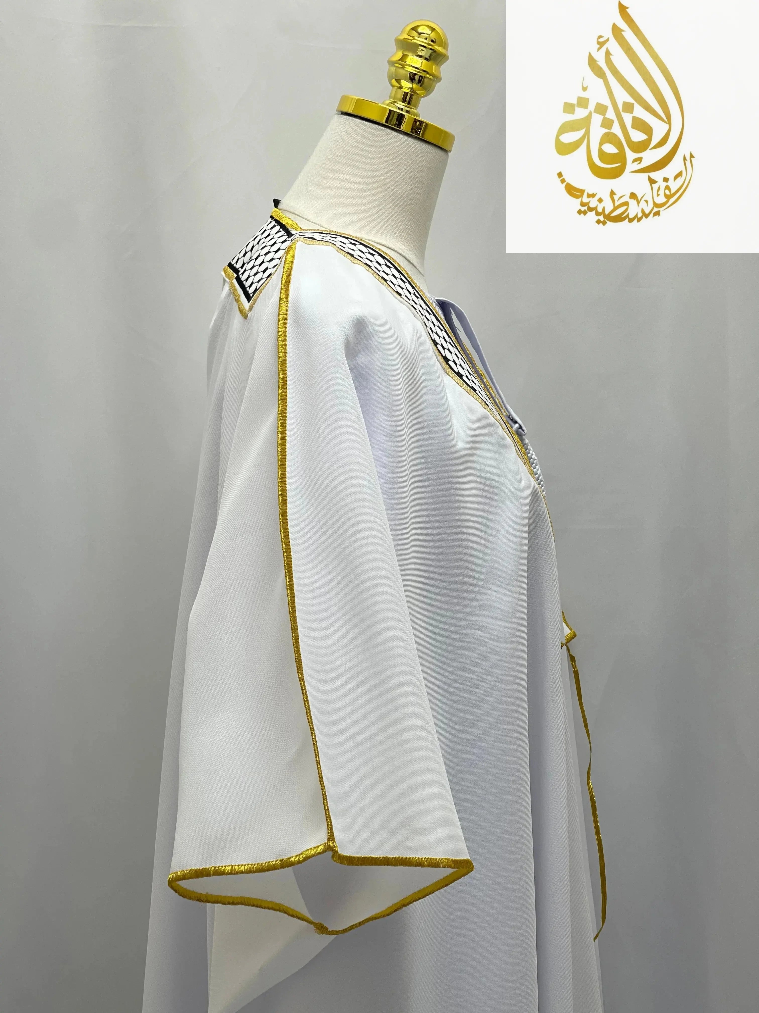 White men thobe with gold trim and keffiyeh pattern collar by Palestinian Elegance keffiyeh bisht for sale