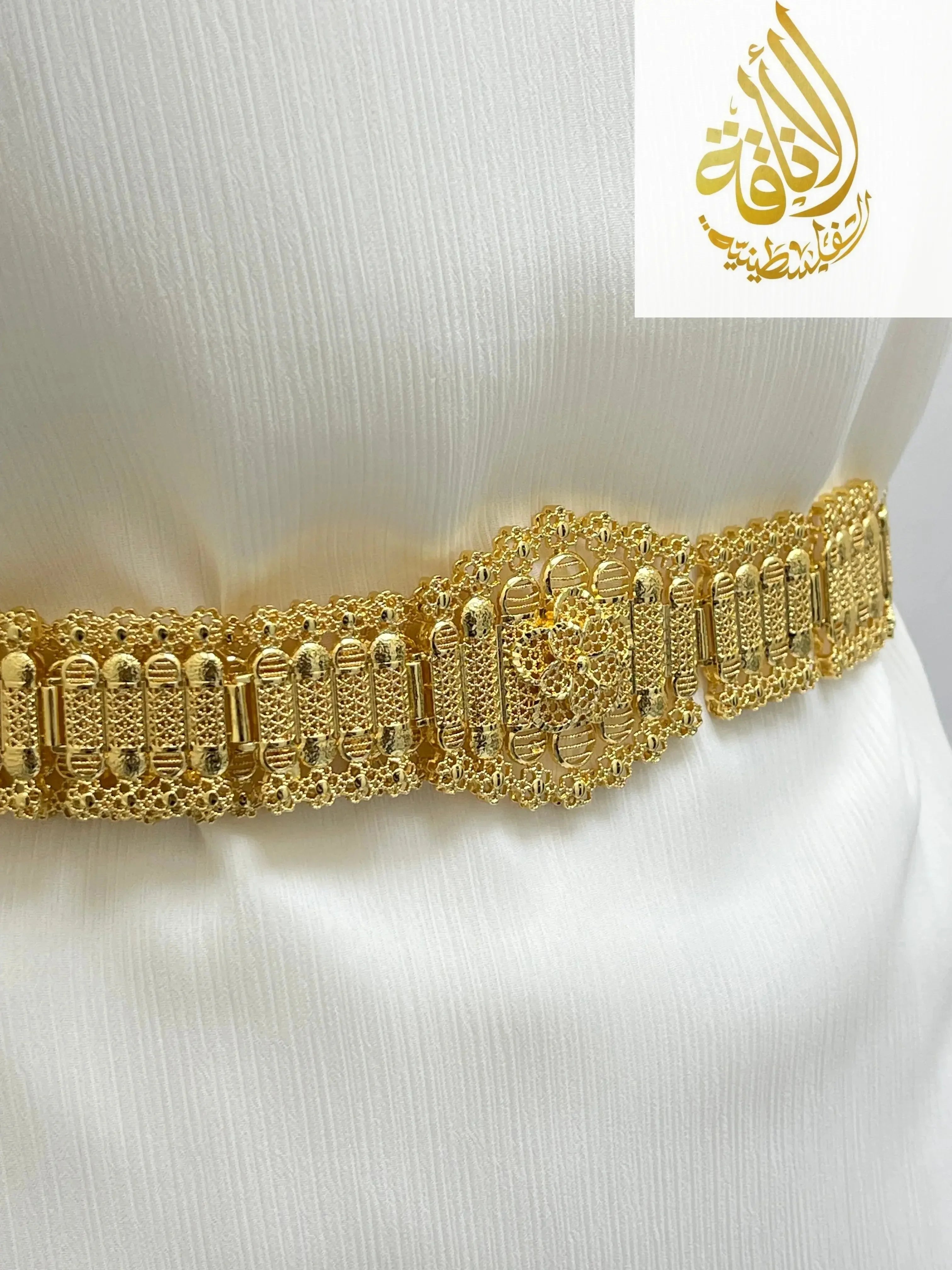 Palestinian Elegance Kurdish gold style belt with intricate gold detailing worn on white fabric