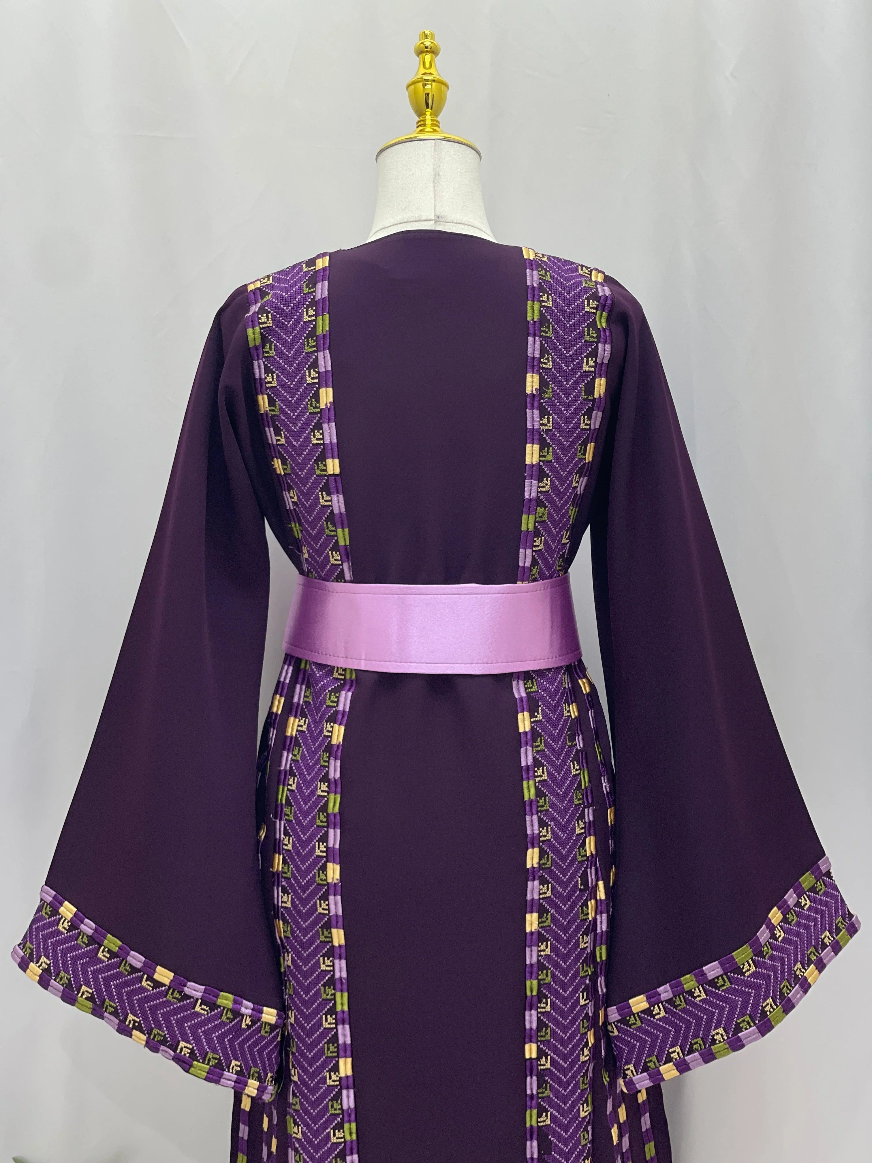 Back view of Lavender Heritage Embroidered Thobe with intricate stitching and a satin belt