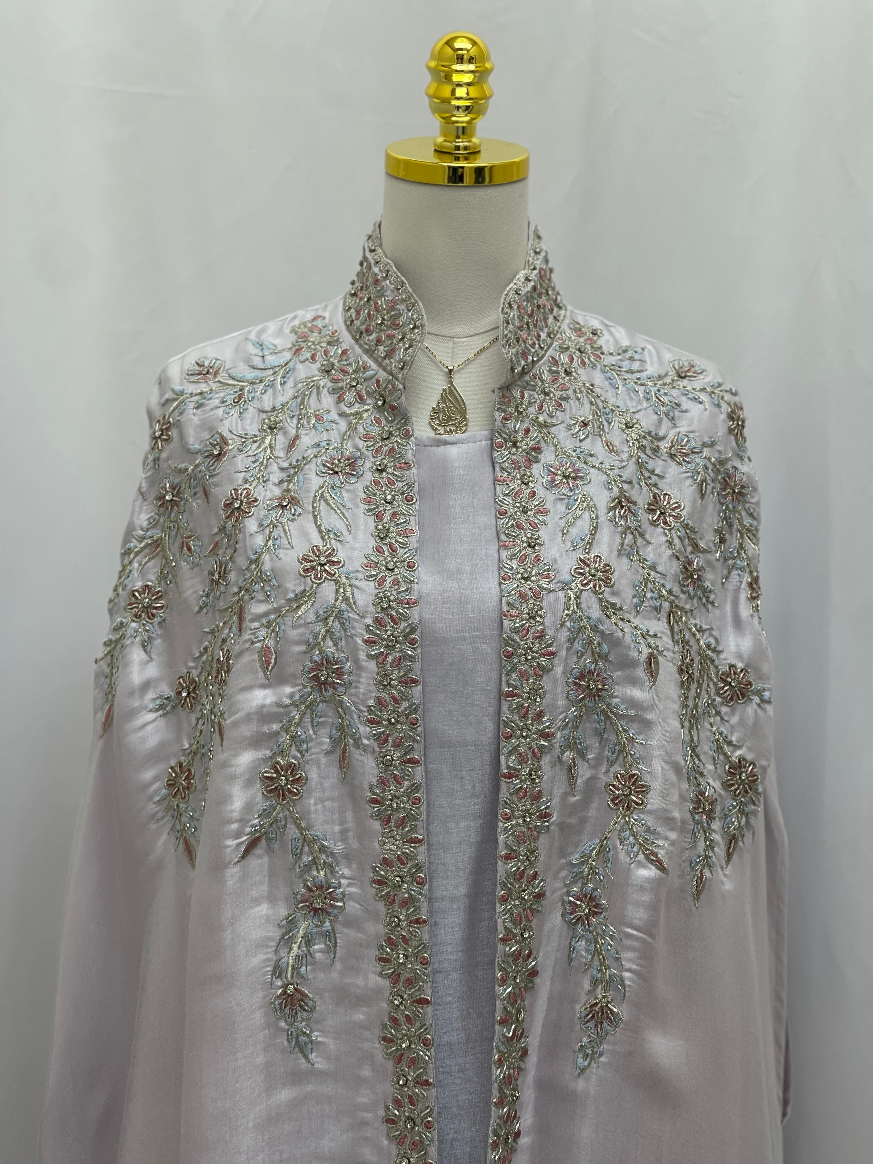 Palestinian Elegance Layla Fancy kaftan with intricate floral embroidery on white fabric