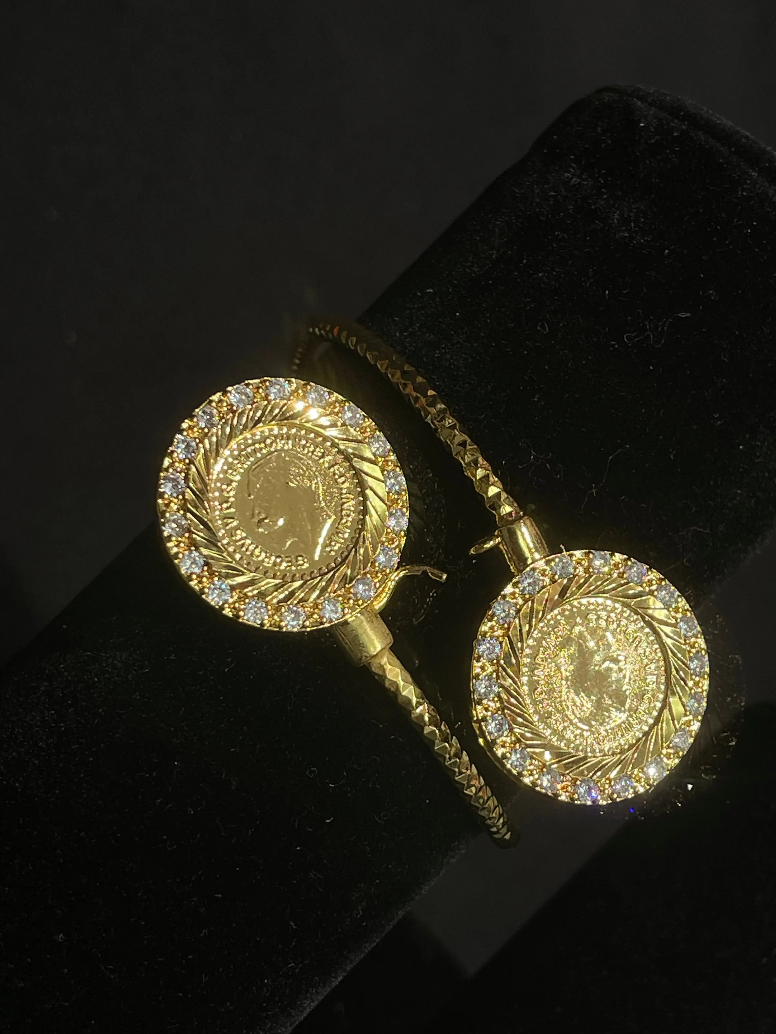 Imitated gold Lera Mabroma Rhinestone Bracelet by Palestinian Elegance with detailed coin design