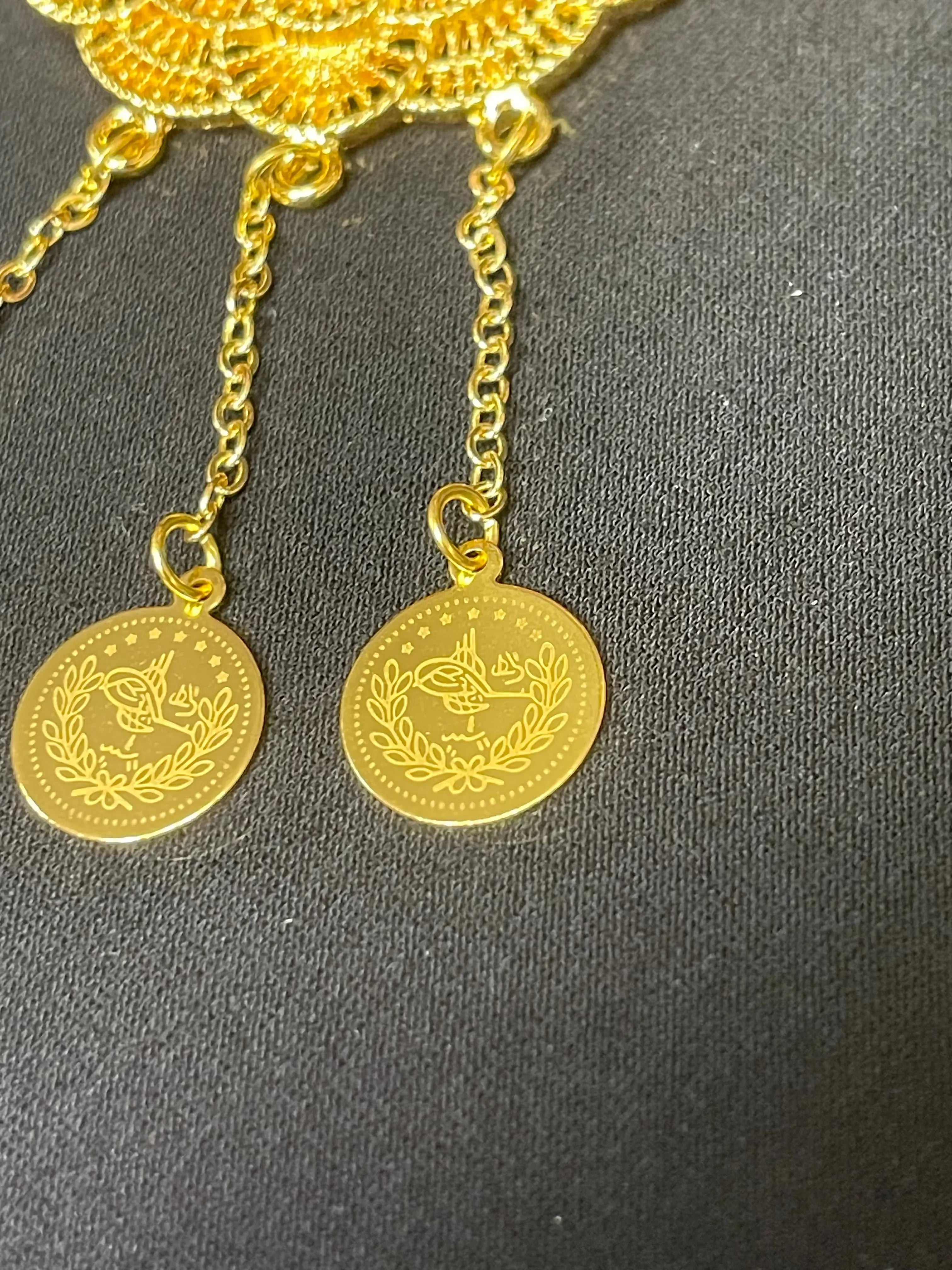 Close-up of Lera Pin in Imitated Gold by Palestinian Elegance featuring intricate chain and circular pendant design