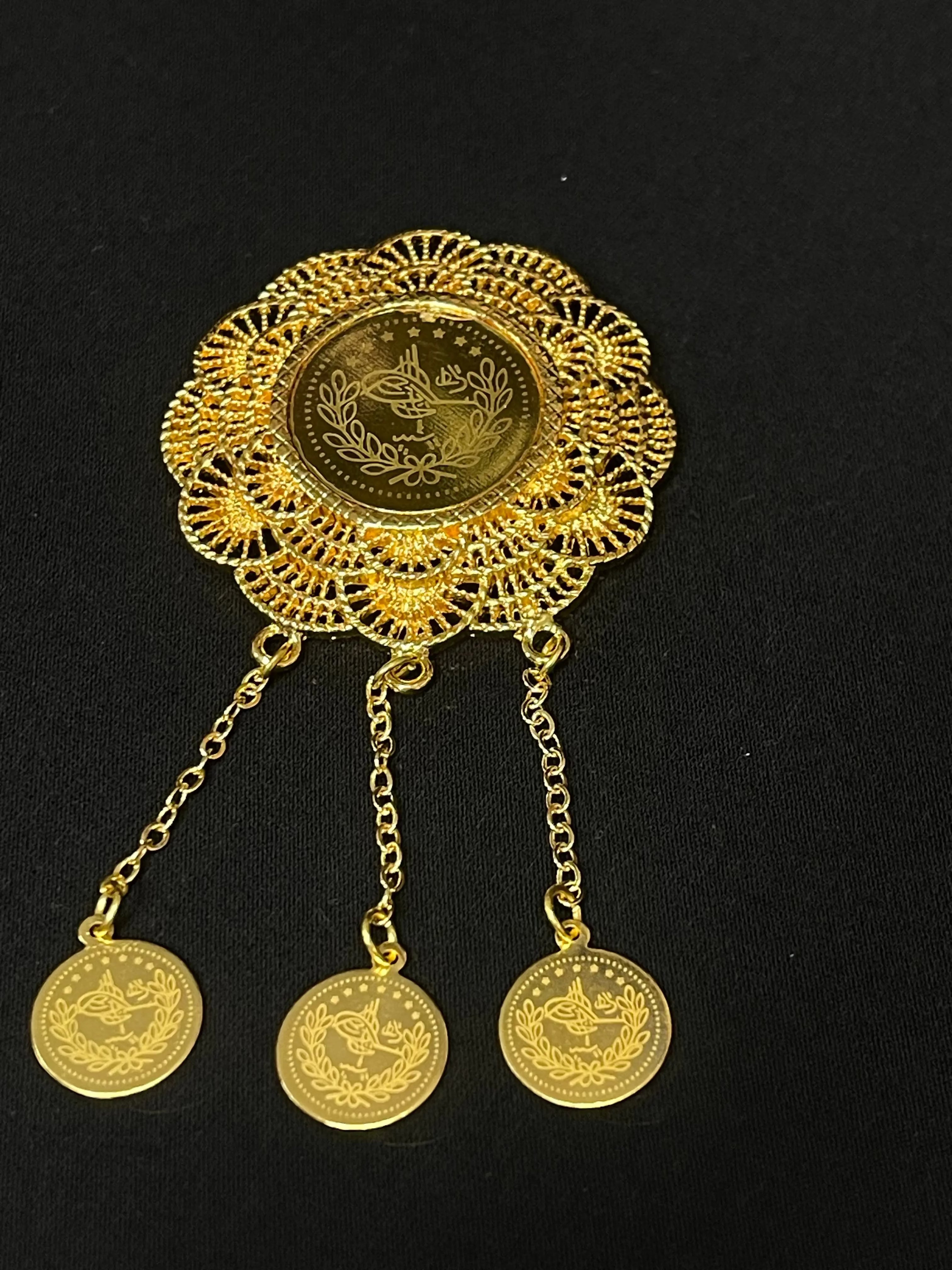 Lera Pin in Imitated Gold by Palestinian Elegance with intricate filigree and delicate dangling coins
