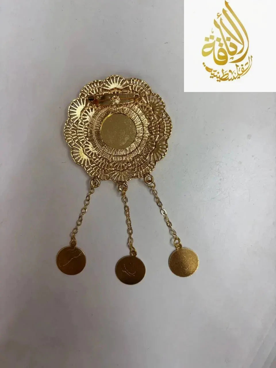 Lera Pin in Imitated Gold with intricate floral design and three dangling circular charms