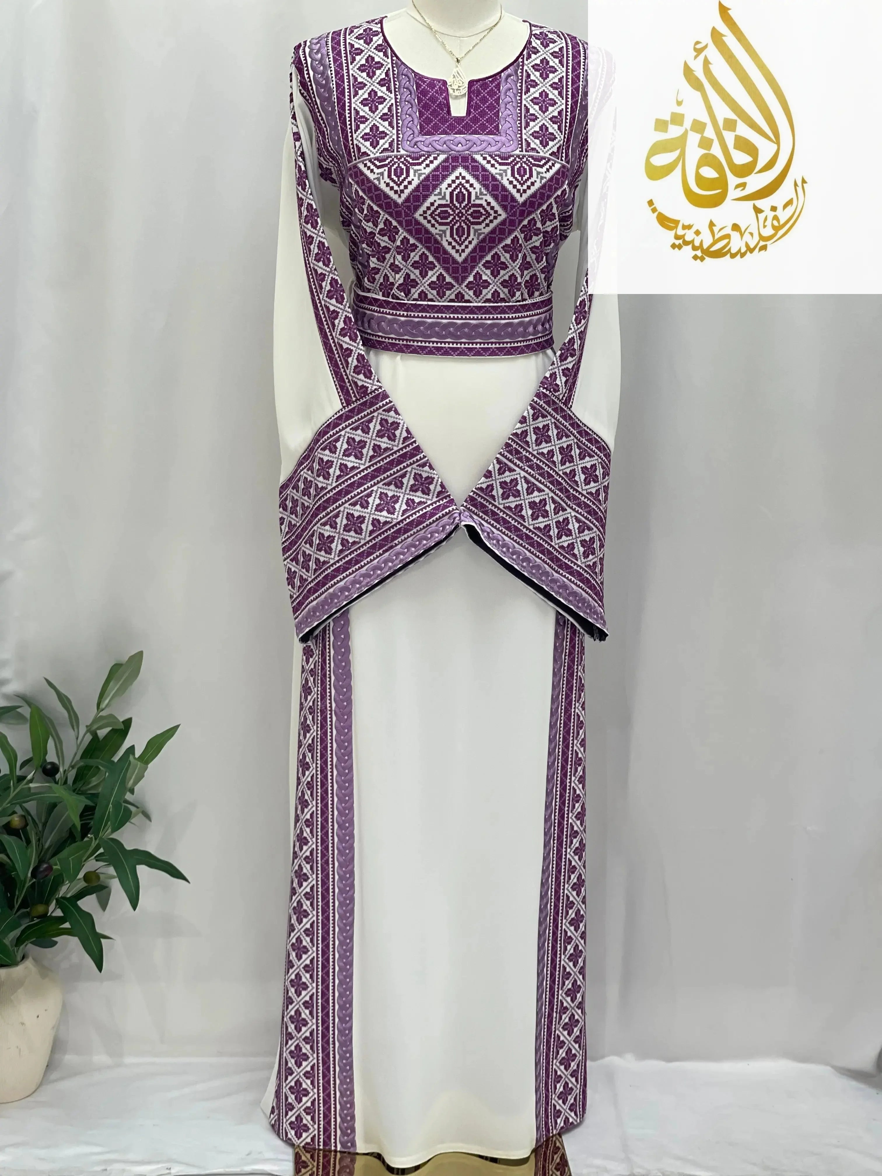 Lilac Embroidered Unique Thoub by Palestinian Elegance with intricate traditional embroidery on white fabric