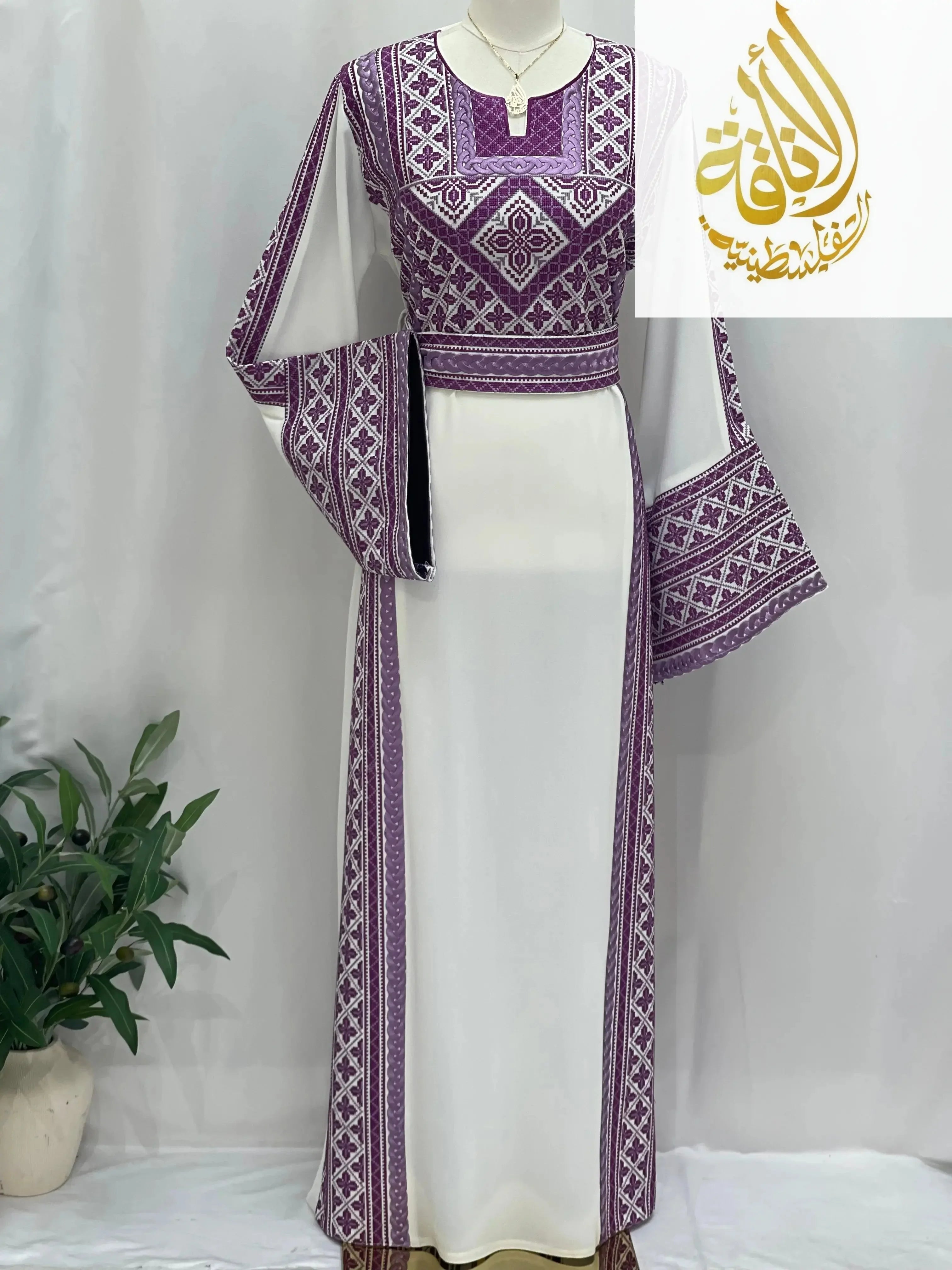 Palestinian Elegance Lilac Embroidered Unique Thoub with intricate traditional patterns on white fabric