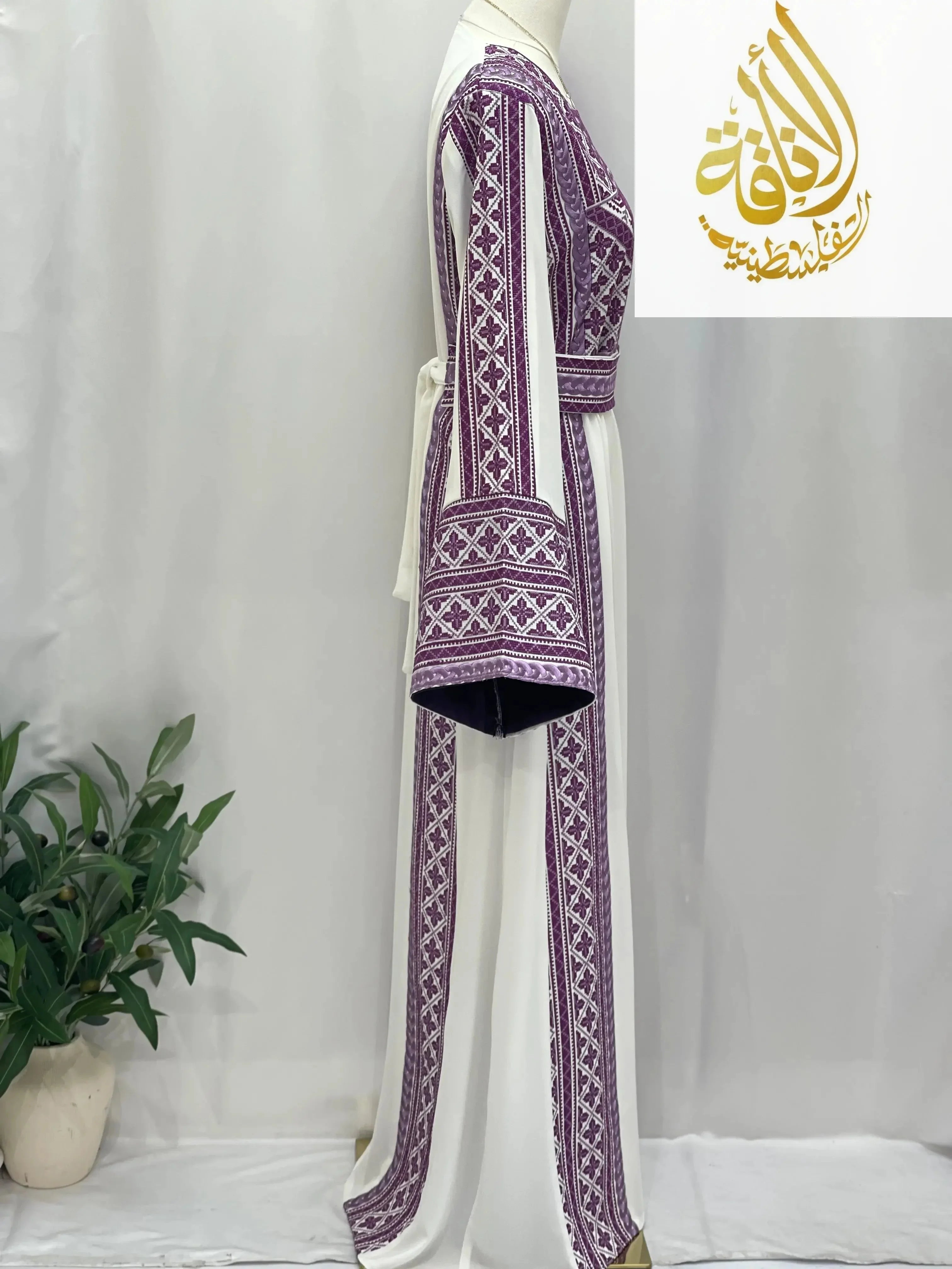 Palestinian Elegance Lilac Embroidered Unique Thoub with intricate traditional embroidery on white fabric