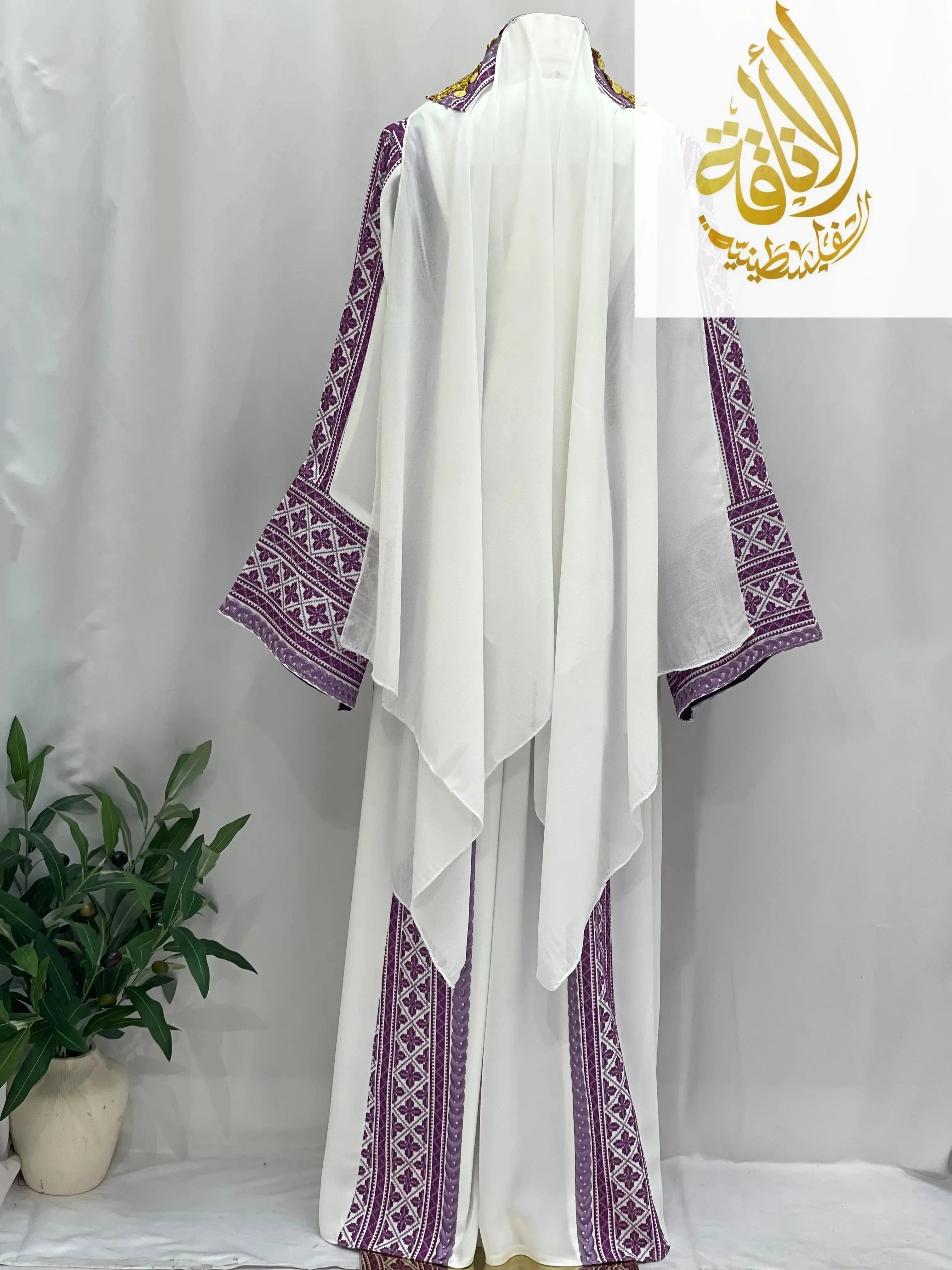 Lilac Embroidered Unique Thoub by Palestinian Elegance with traditional detailed lilac embroidery on white fabric