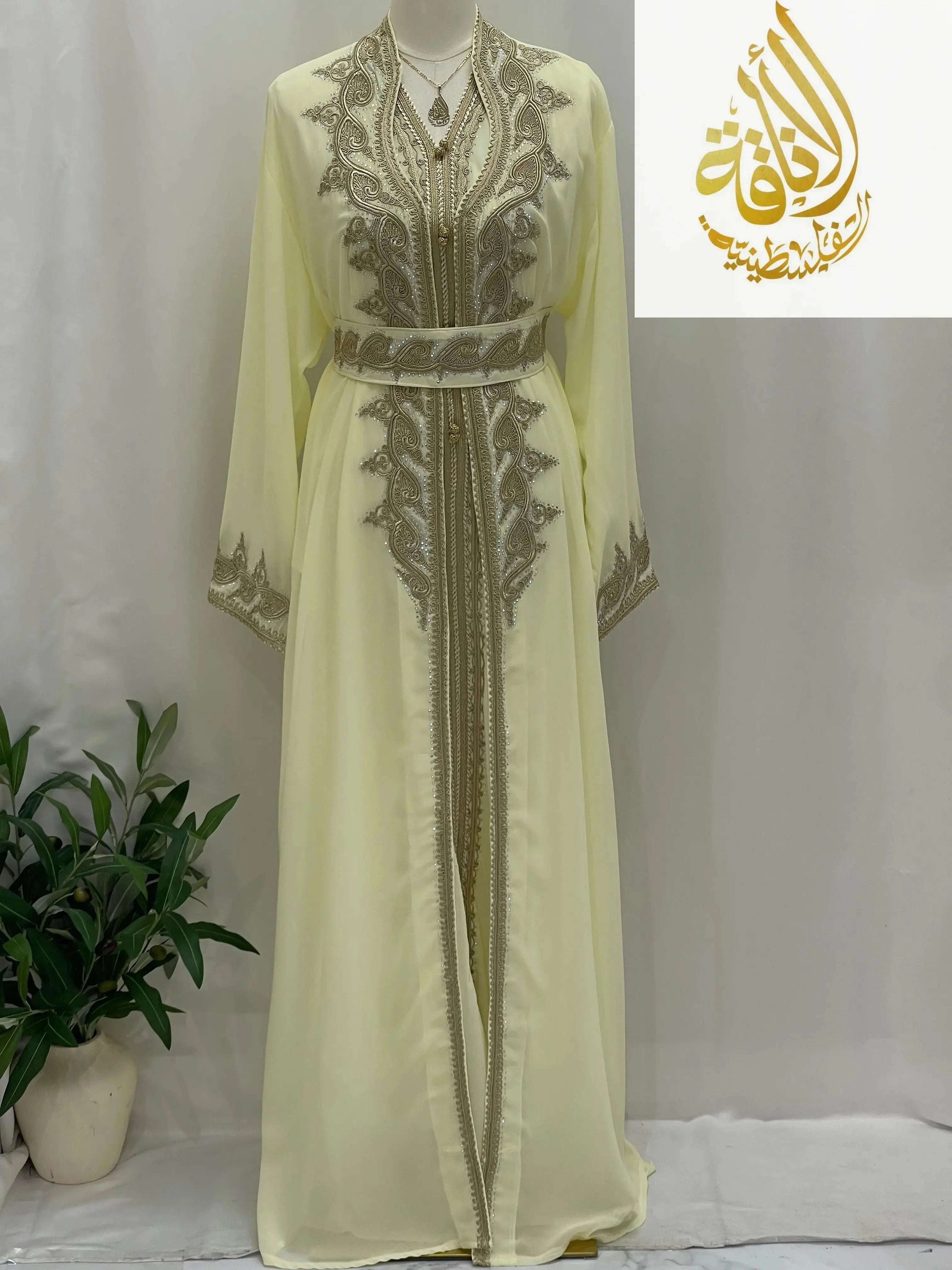 Palestinian Elegance luxurious Alamera kaftan in light yellow with intricate gold embroidery and matching belt