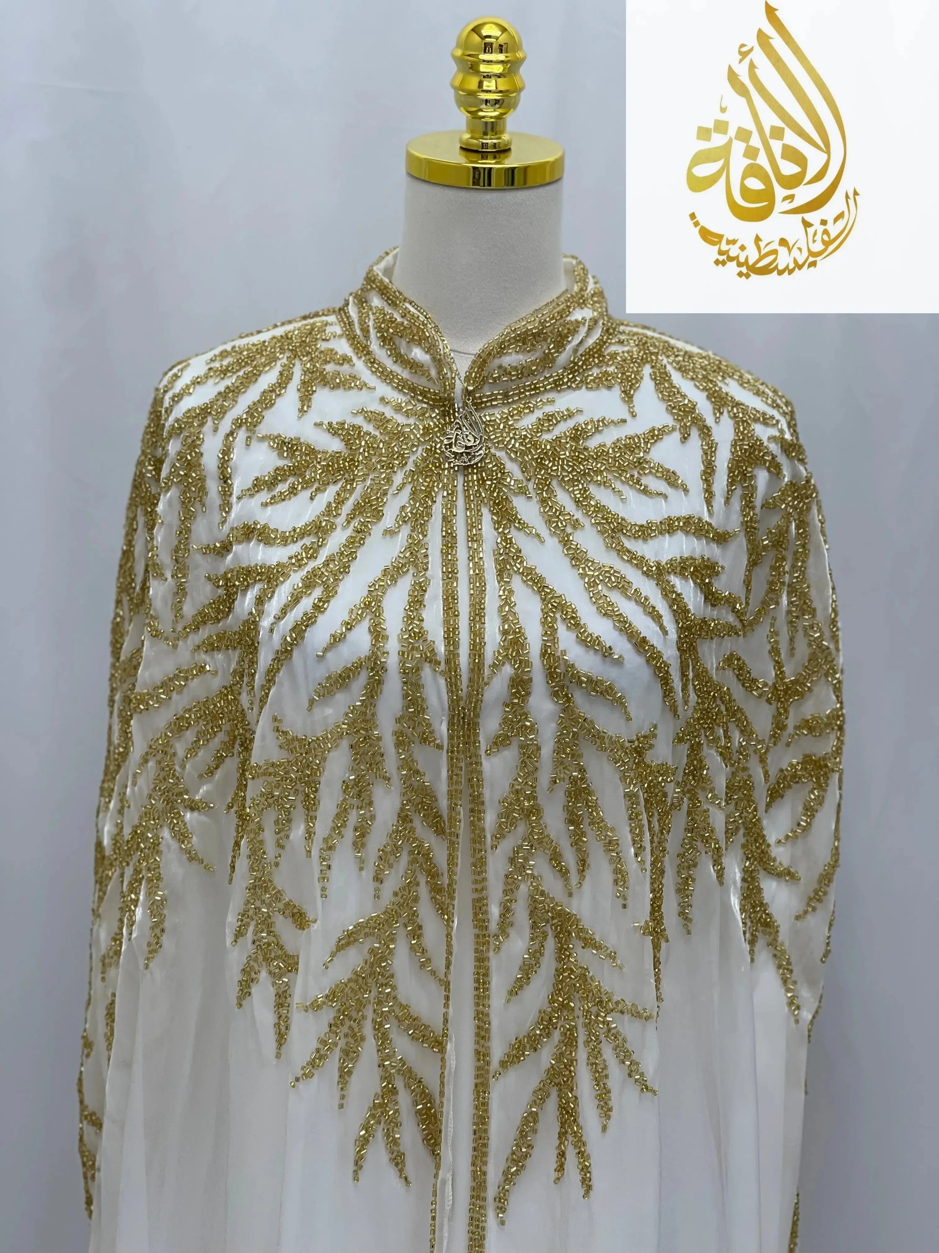 Palestinian Elegance Luxury Majestic Embellished Cape cardigan with gold intricate beadwork on white fabric