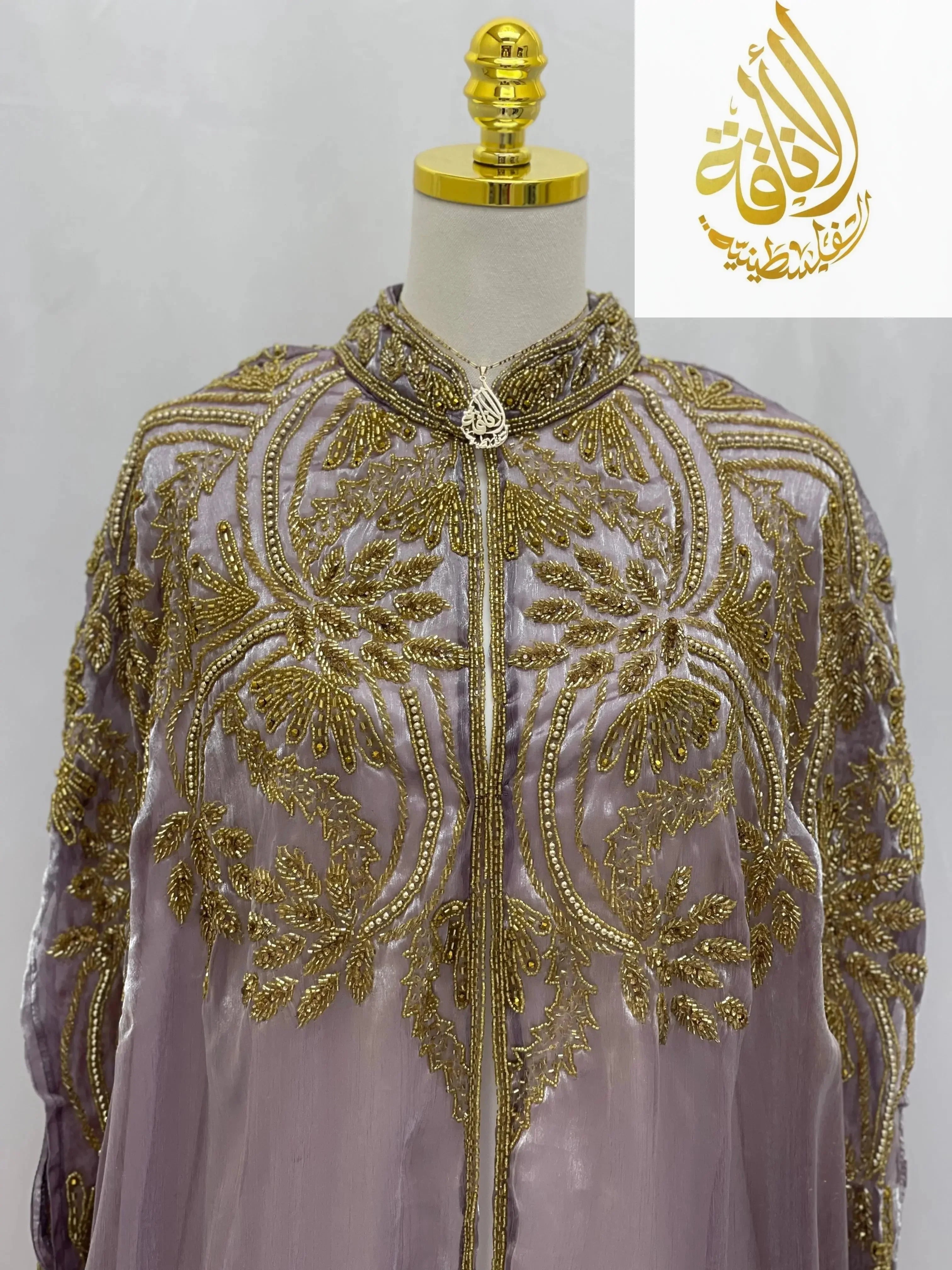 Palestinian Elegance Regal Frosted Lavender Cape cardigan with intricate gold embroidery and decorative zipper