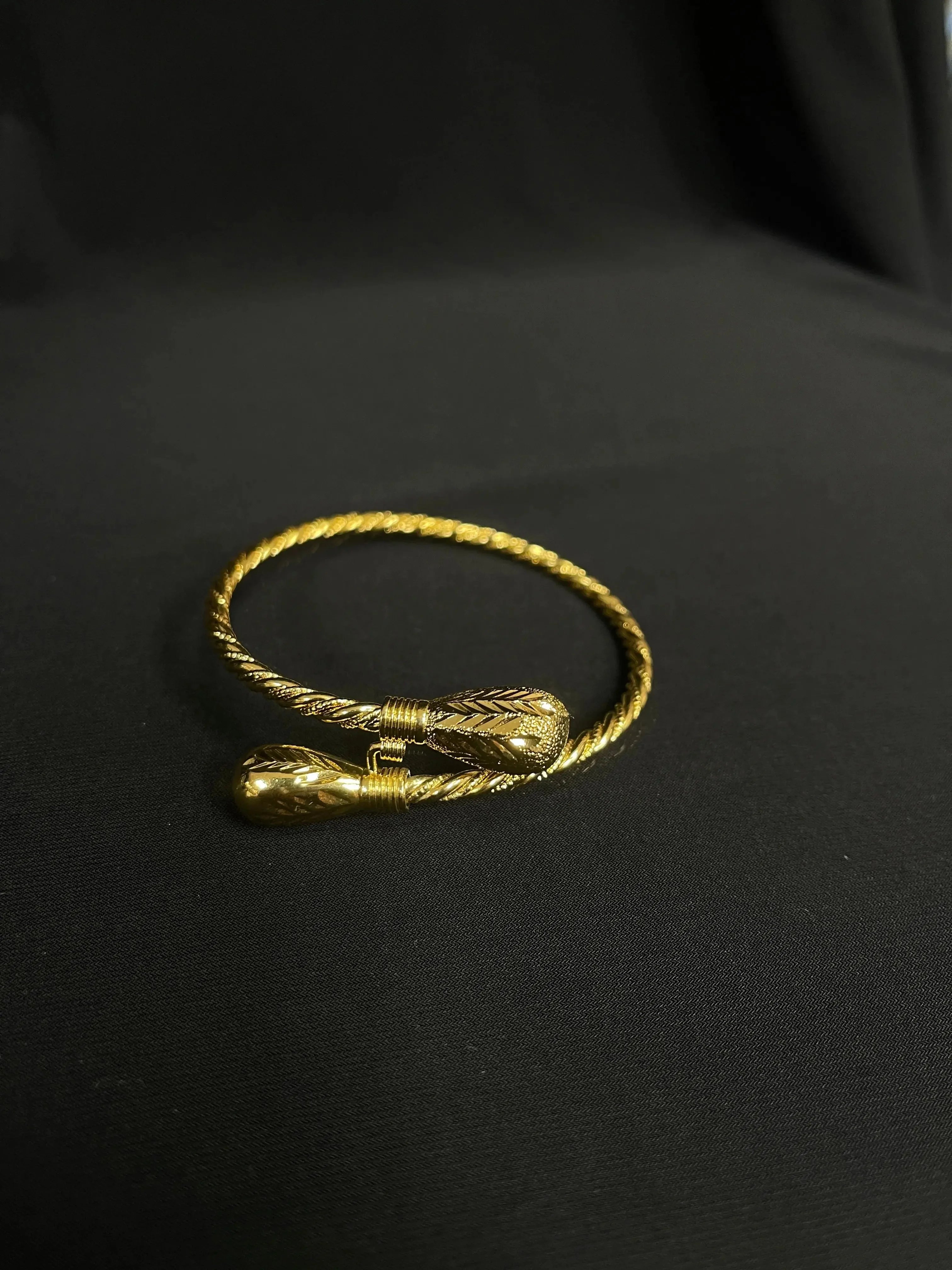 Mabroume imitated gold bracelet for women with twisted design and detailed ends by Palestinian Elegance