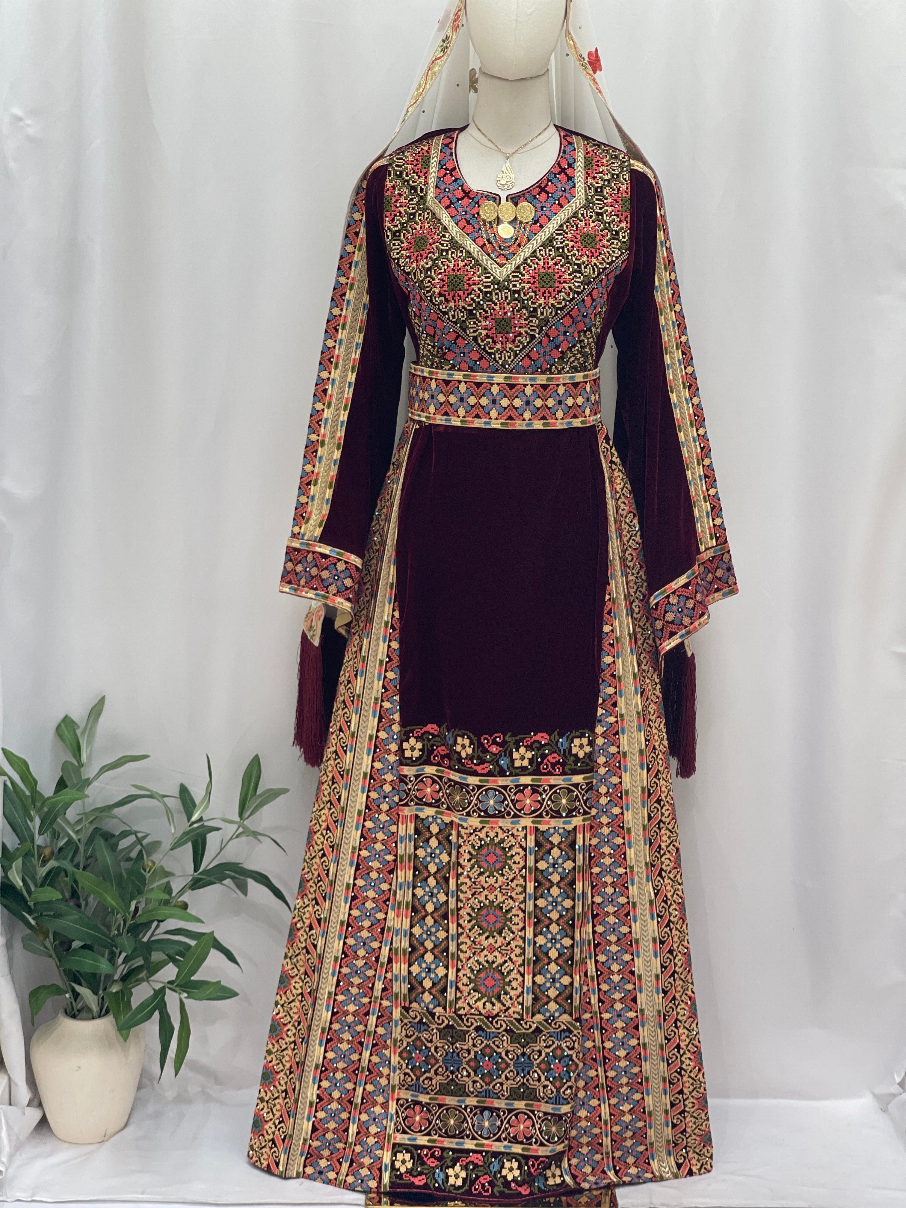 Maise Velevt Embroidered Thoub in rich burgundy with intricate floral designs and elegant details