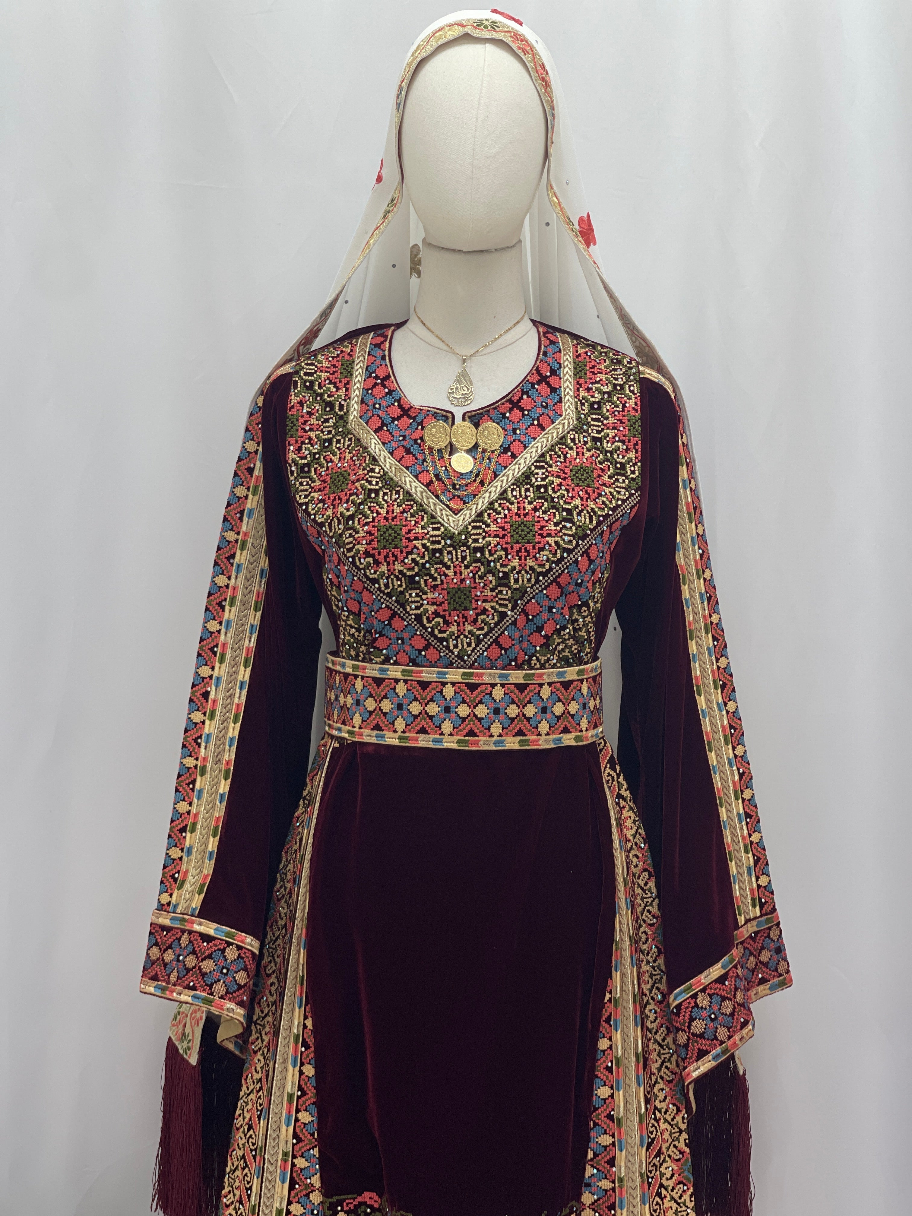 Elegant Maise Velvet Embroidered Thoub featuring vibrant floral designs and intricate details