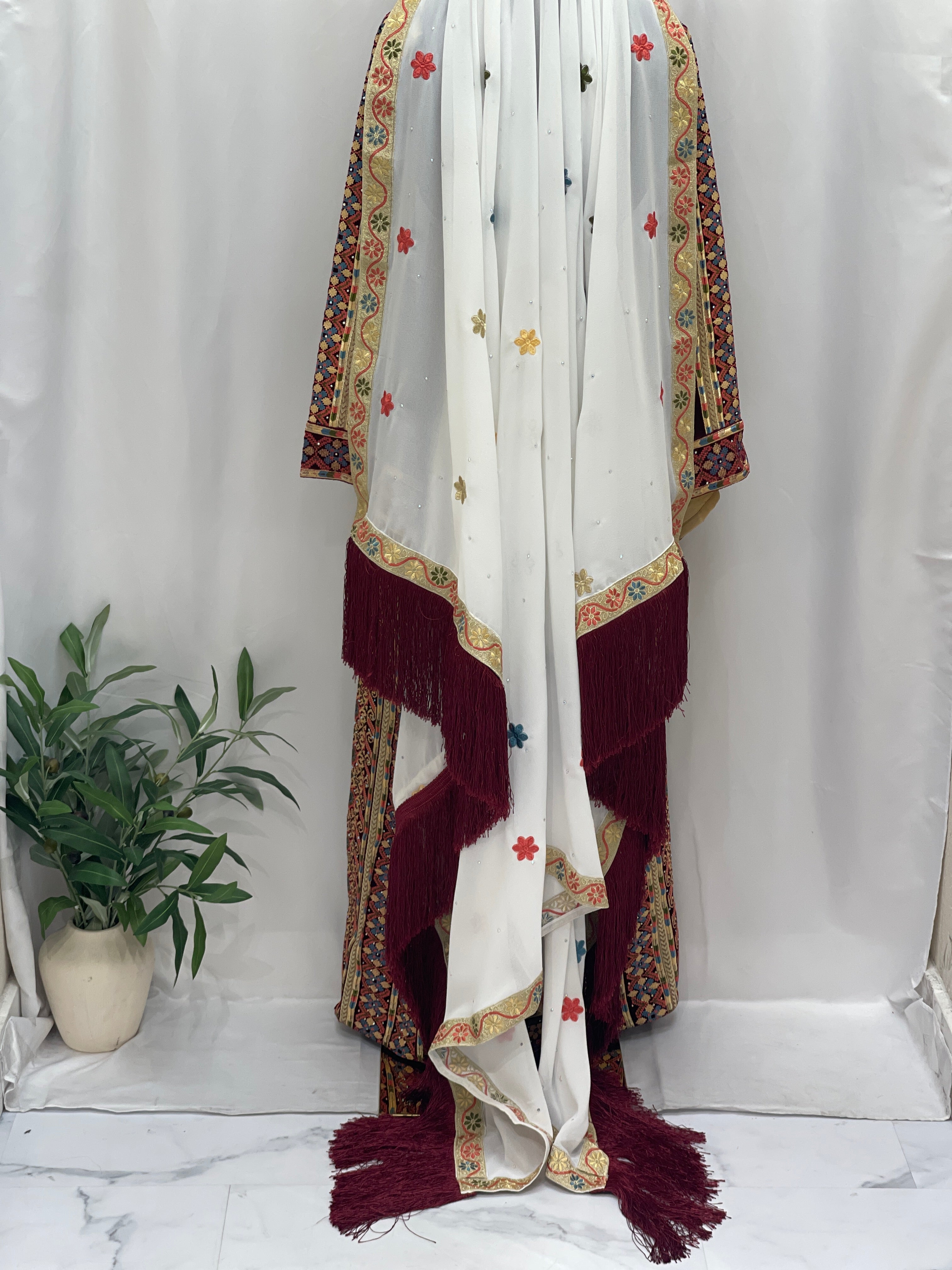 Elegant Maise Velevt Embroidered Thoub featuring intricate floral designs and fringe detailing