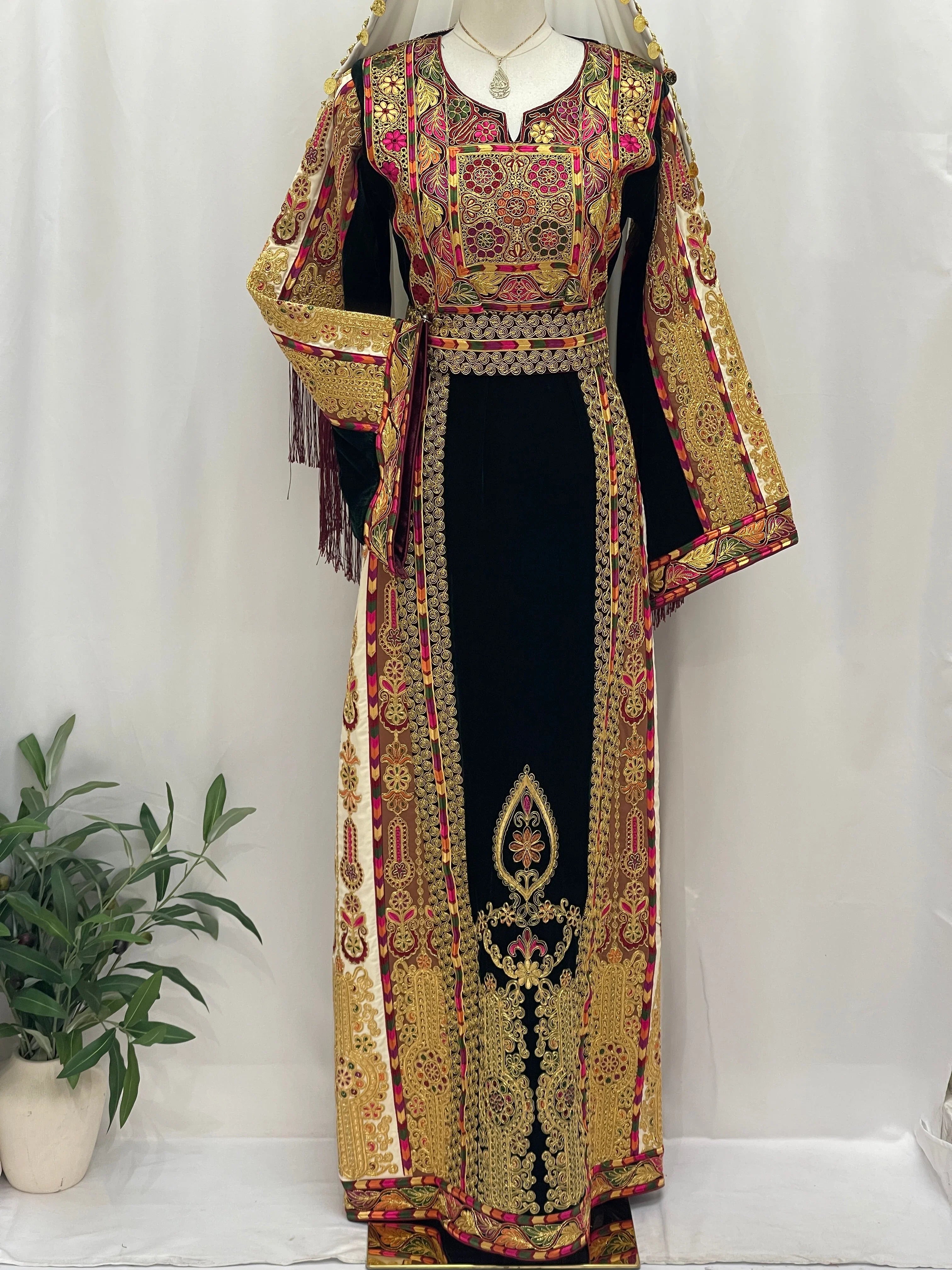 Malika Queen Emerald Thobe with intricate embroidery and vibrant gold designs for elegant occasions